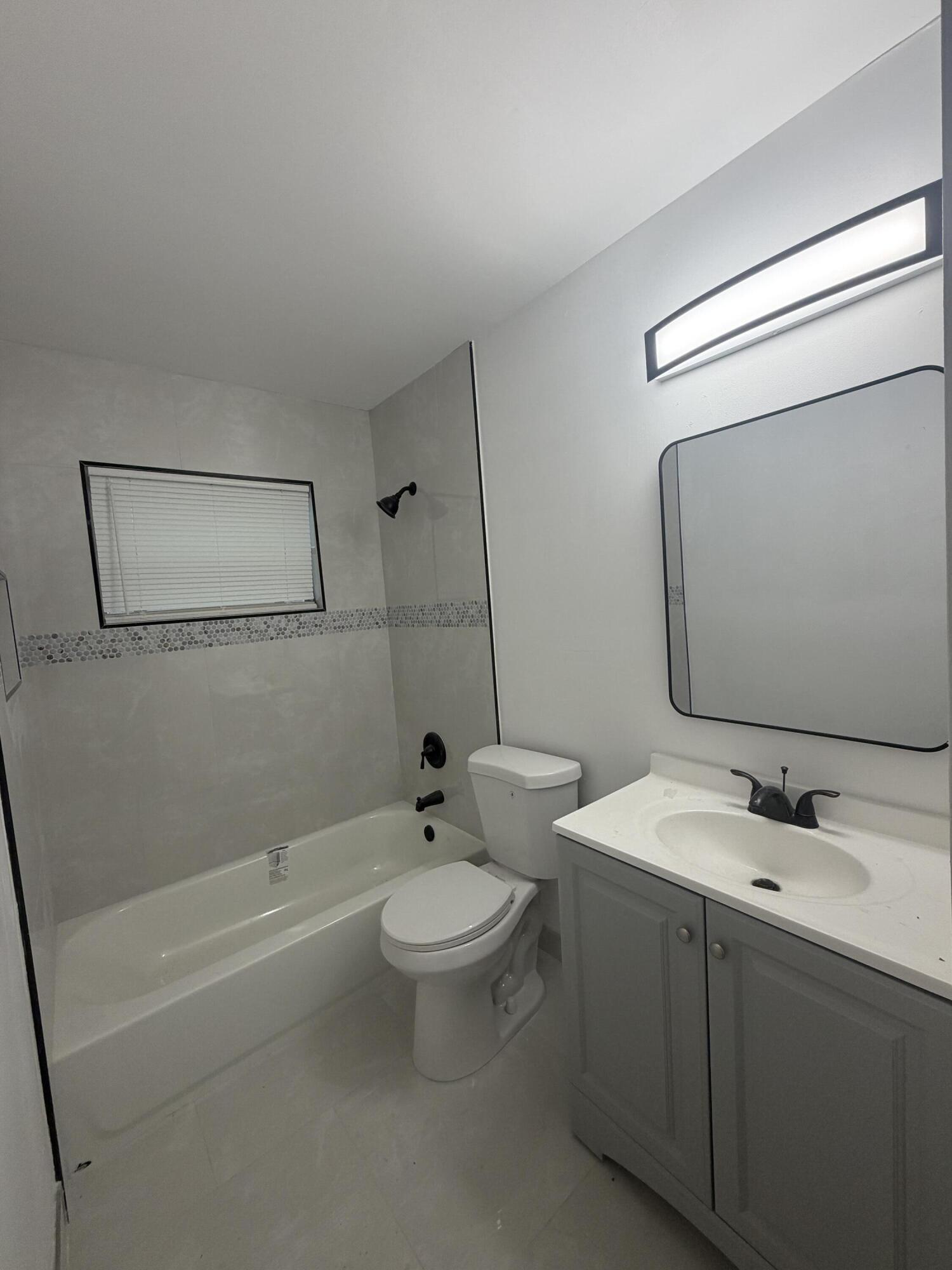 Low Taxes $1,544 from Year 2025. 4/2 + GARAGE. Corner lot. Beautiful Porcelain tile throughout. Fresh paint.