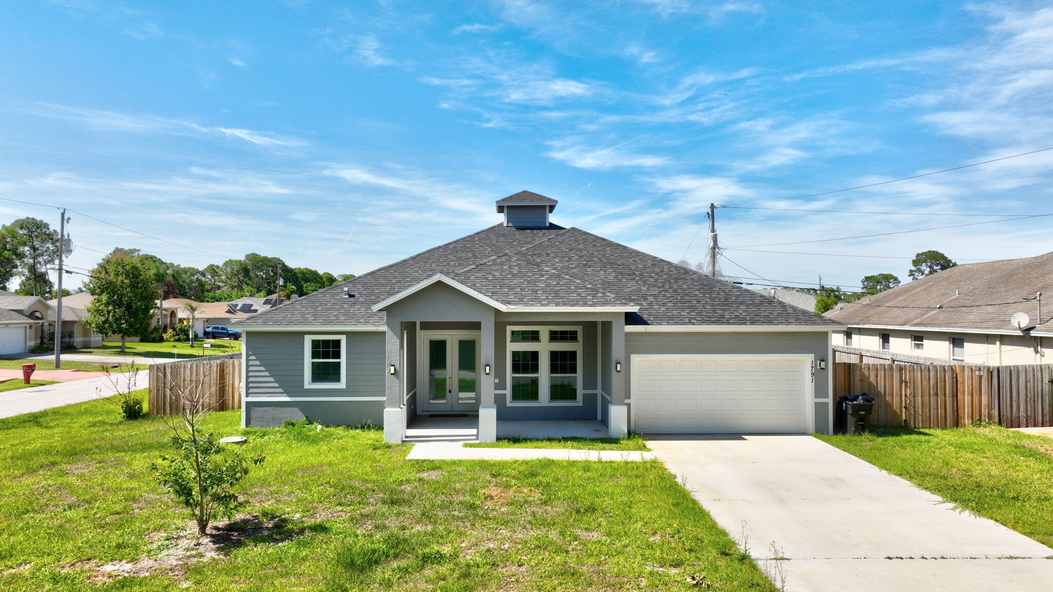 Why wait to build? Move into this 2024 construction in Port St. Lucie only lived in for 1 year- This 4 bed, 3 bath 2 car-garage home comes with impact windows and offers 2,239 sq ft of modern living in a non-HOA neighborhood. Sleek cabinetry, generous counter space, and a bright open layout designed for everyday comfort. A new washer and dryer (March 2025) adds extra convenience. Theres more! A NEWLY INSTALLED FENCE for ultimate privacy. Located in fast-growing Port St. Lucie, known for its parks, shopping, and easy access to beaches and highways, this home blends style, space, and location perfectly.