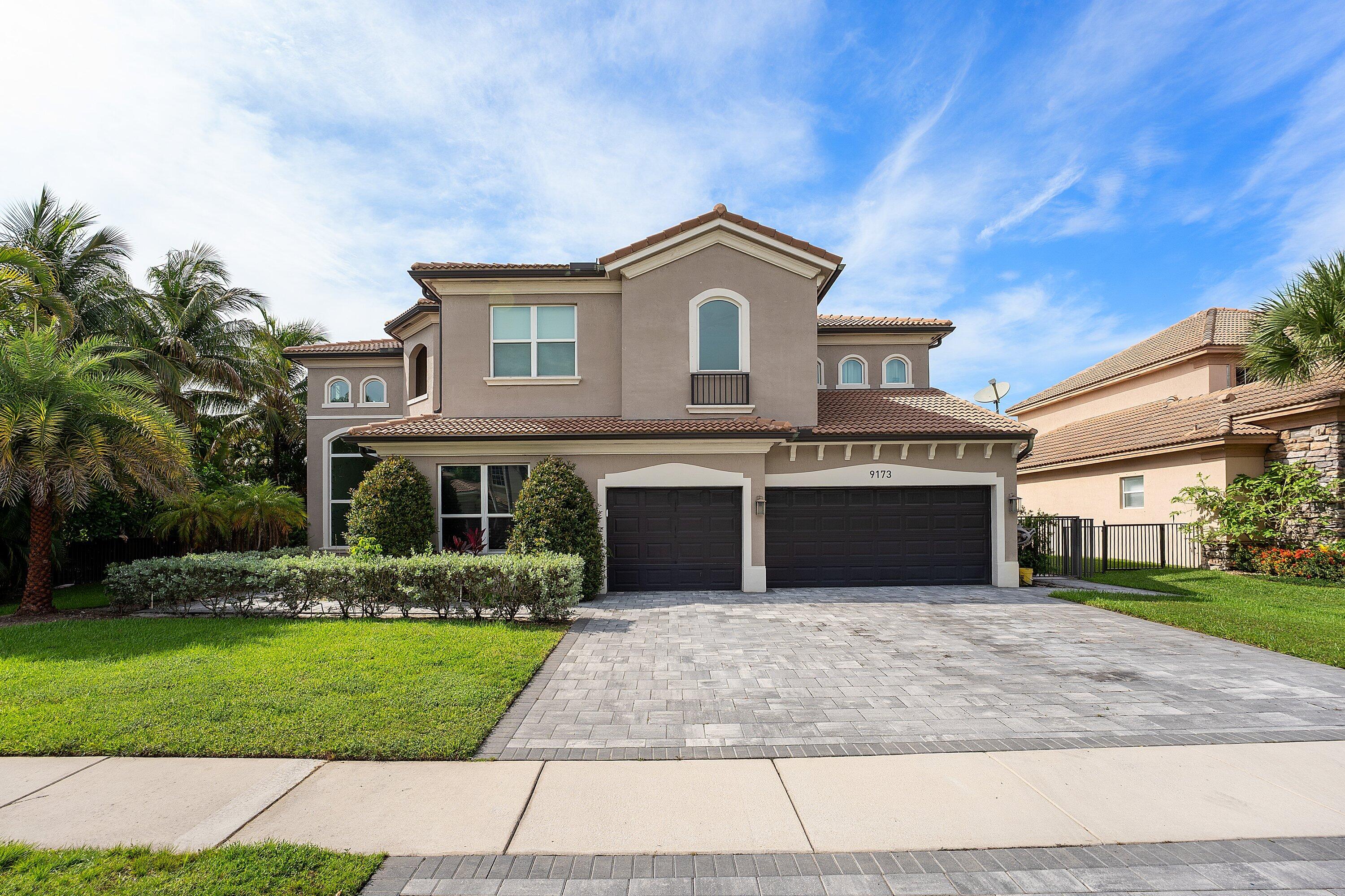 Experience the best of South Florida living in this exceptional 5 bedroom, 4 bath lakefront home with 3 car garage in desirable Country Cove Estates. Designed for both everyday comfort & entertaining, the home features spacious living areas, generously sized bedrooms, a remodeled kitchen with quartz countertops, stainless steel appliances, custom cabinetry, & a built-in bar & entertainment area. All bathrooms have been tastefully remodeled, while impact windows & doors & tile flooring throughout provide style & peace of mind. Step outside to your private backyard retreat featuring an oversized patio, resort-style pool with waterfall & splash fountain, full automation, & tranquil views. Conveniently located near shopping, dining & the Turnpike, this home offers Florida living at its finest. Some images AI Generated as stated and shown .