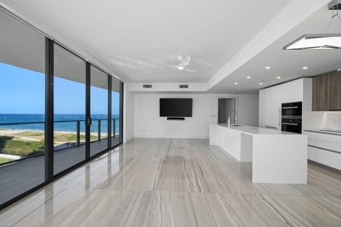 This 2-bedroom, 2.5-bath corner residence offers stunning ocean views with breathtaking sunrises and sunsets. Spanning 1,760 square feet, the home features a desirable split floor plan, floor-to-ceiling impact glass, an open kitchen with Miele and Sub-Zero appliances, wine fridge and a spacious wraparound balcony ideal for indoor-outdoor living. Thoughtful upgrades include a luxury Toto toilet/bidet, Sonos speakers, custom closets, a large pantry, and motorized blinds throughout. Residents enjoy the full suite of amenities at Sabbia Beach, including 24-hour valet and concierge services, a heated pool and spa, and a state-of-the-art fitness center—offering refined oceanfront living in the heart of Pompano Beach.