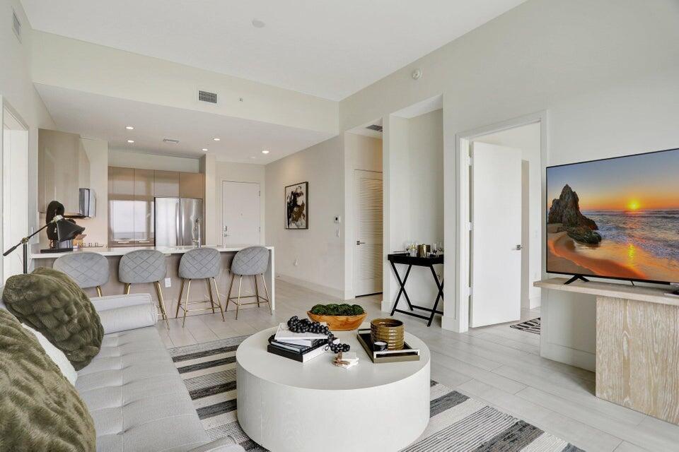 Experience elevated living in this designer-inspired 2 Bed / 2 Bath LOWER PENTHOUSE at Metropica. Perched on the 26th floor, Unit 2607 boasts a rare south-facing balcony with sweeping skyline views of Forth Lauderdale and Miami. The residence is masterfully decorated, blending modern sophistication with comfort, and showcases meticulous attention to detail throughout. Enjoy Metropica's resort-style amenities, vibrant lifestyle, and prime location- steps from fine dining, shopping and entertainment, and easy assess to highways.
