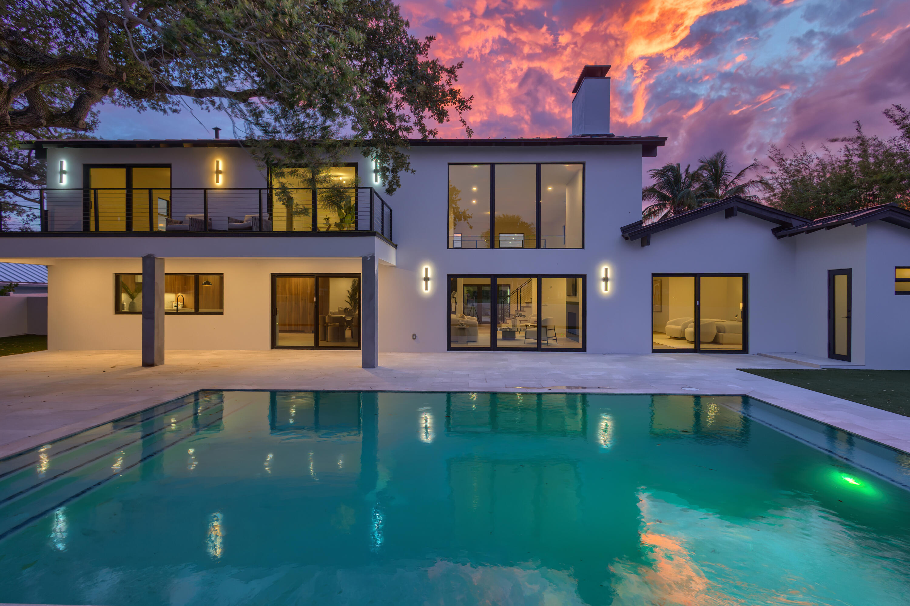 An extraordinary newly renovated estate nestled within the prestigious Village of North Palm Beach. Offering an unparalleled lifestyle, this exceptional residence enjoys sweeping panoramic views of the beautifully manicured 13th fairway of the renowned North Palm Beach Country Club golf course, redesigned by Jack Nicklaus. Thoughtfully renovated this stunning residence exudes modern luxury. Boasting 6,245 total sqft and nearly 5,000 sqft under air on an expansive 15,000-square-foot homesite, every detail has been carefully curated to create a sophisticated yet comfortable living experience. Enhancements include a newly installed metal roof, impact-resistant windows and doors, updated HVAC system, upgraded plumbing, and a reimagined floor plan designed to maximize both functionality and  style. The designer kitchen features custom solid wood cabinetry, premium Miele appliances, and refined finishes. The spacious interior showcases soaring ceilings throughout the main living areas, creating an open and airy ambiance filled with natural light. Four generously sized bedrooms include a first-floor primary suite. The home is complemented by three new full bathrooms and two half baths, offering ample accommodations. An elevated second-floor terrace serves as a private retreat with breathtaking views of the golf course and tranquil lake, creating a perfect backdrop to enjoy the beauty of South Florida living. The property offers direct access to the country club by foot or golf cart. A dedicated golf cart garage makes trips to the course, clubhouse, dining venues, and recreational amenities convenient. Residents enjoy access to the North Palm Beach Country Club featuring the Jack Nicklaus Signature golf course, tennis facilities, an Olympic-sized swimming pool, and clubhouse dining, social events and much more. Residents have the flexibility to enjoy the club's amenities without mandatory membership requirements through a variety of programs while maintaining the freedom to participate as much or as little as they choose. North Palm Beach is renowned for its waterfront setting, marinas, parks, boating access, and proximity to the Intracoastal Waterway and Atlantic Ocean. Combined with top-rated schools, a vibrant coastal lifestyle, and easy access to Palm Beach's finest dining, shopping, airports and cultural attractions, this remarkable residence presents an extraordinary opportunity to experience the best of luxury living.
