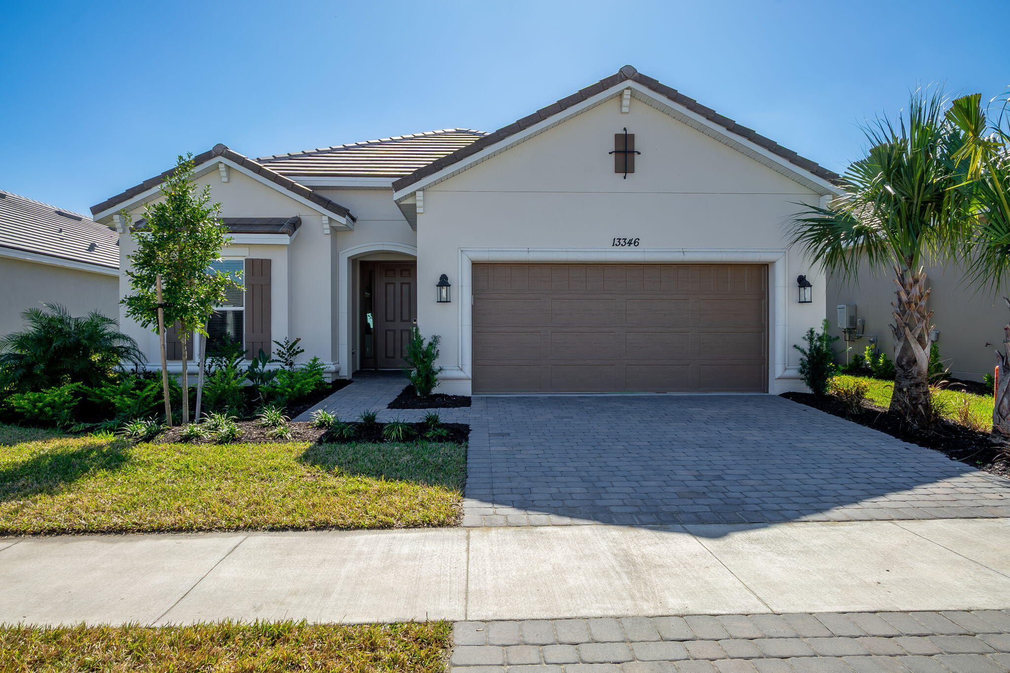 WOW ! Brand-new waterfront construction in Esplanade at Tradition featuring over $125,000 in premium upgrades. Thoughtfully designed with elegant neutral tones, tray ceilings, upgraded flooring, and a gourmet kitchen with GE Café appliances, plus many more enhancements too numerous to list. This move-in ready home offers refined living in a vibrant 55+ community with resort-style pool, fitness center, yoga and exercise classes, personal trainers, card and billiard rooms, bistro café, concierge services, and a full-time lifestyle director. Ideally located near Tradition Village, dining, and shopping. A must-see opportunity!