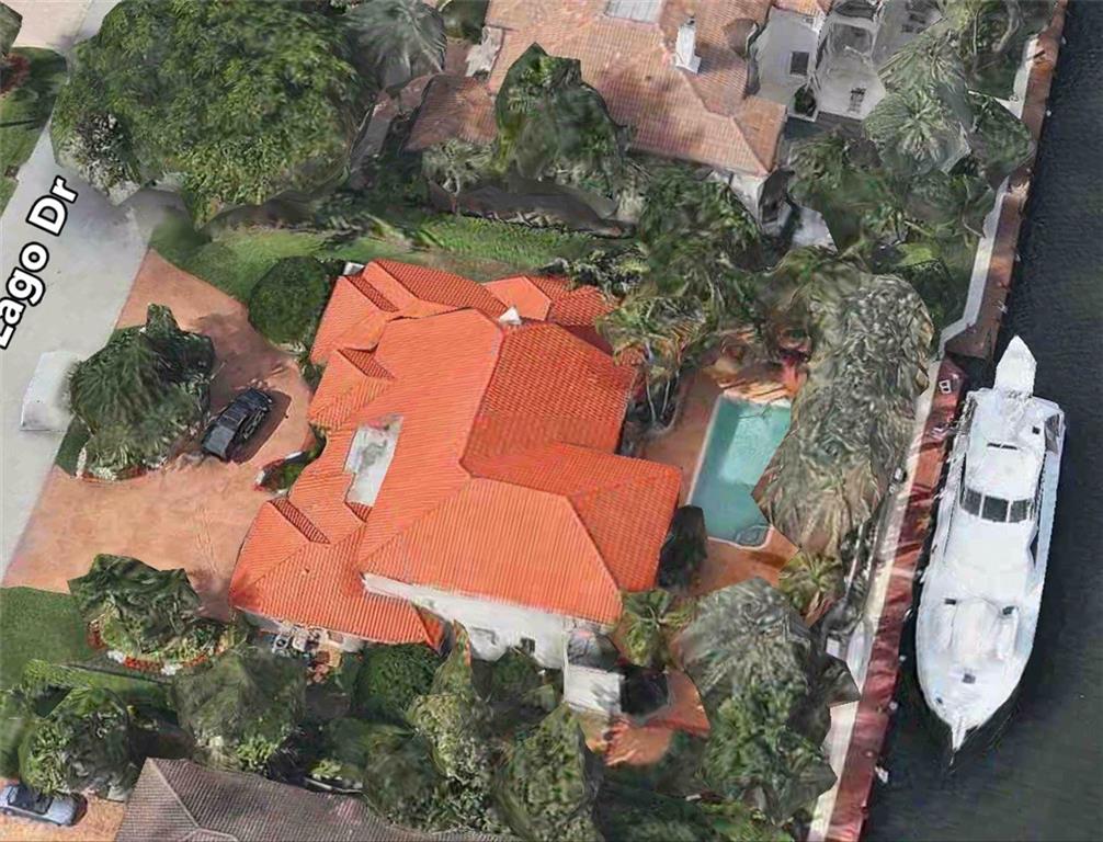 Best value in Harbor Beach.  Luxury home in move-in condition or build new home on huge  lot (150'x120').  New dock, deep water and 140' wide canal with quick ocean access.   Circular drive and 3 car garage.  2 master suites, large rooms and high ceilings.  Large heated pool.  Surrounded by $10,000,000 + homes.  Private beach facility and 24/7 security patrol available.