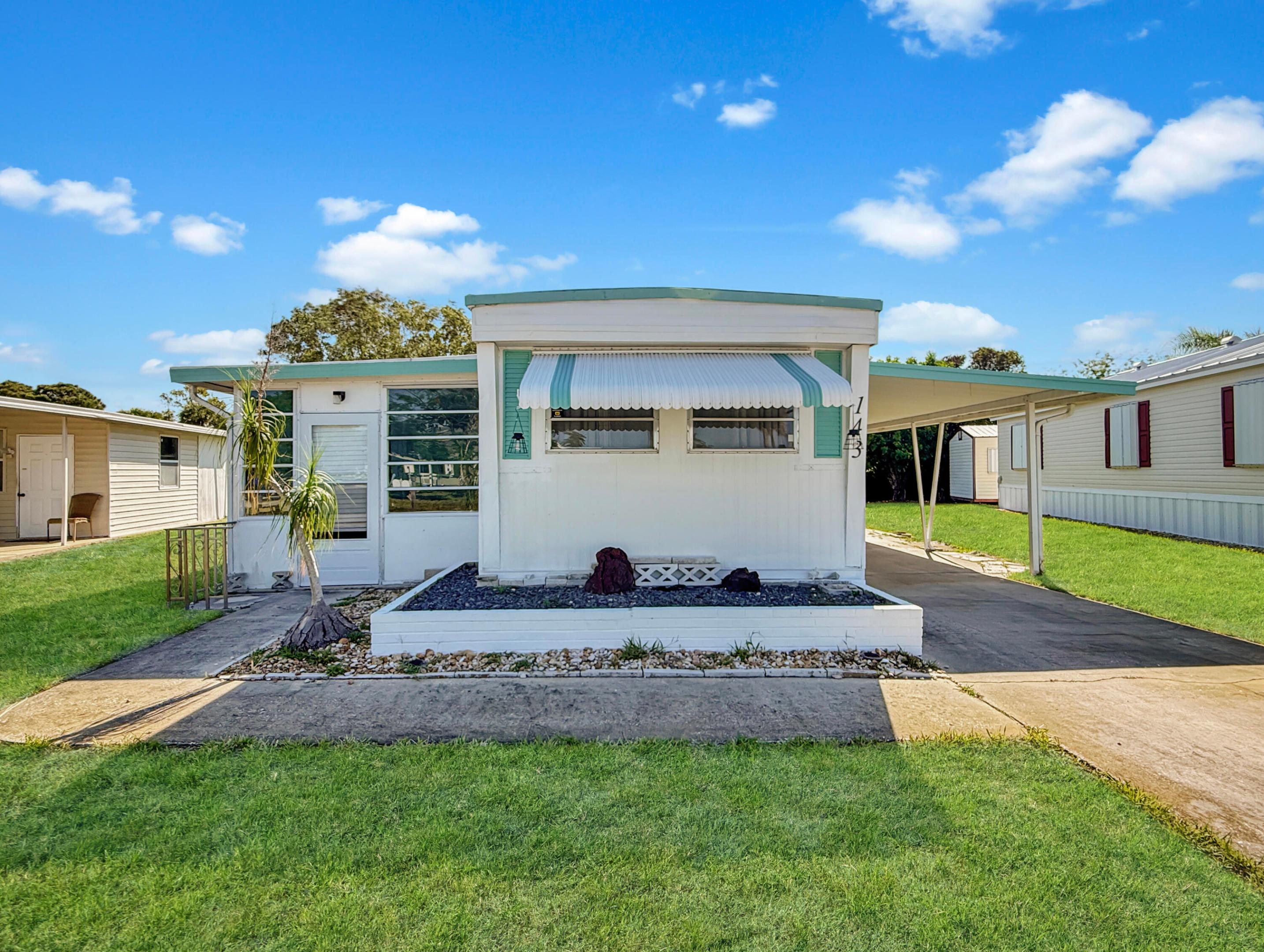 Located in the desirable Leisure Village Mobile Home Community 55+ community in Stuart, this 2-bedroom, 1.5-bath single-wide mobile home offers plenty of potential for the right buyer! Features include two large glass-enclosed porches, a connected workstation area, eat-in kitchen, and spacious living room. Enjoy being within walking distance to the community clubhouse featuring a pool, shuffleboard courts, library, and community kitchen for residents to enjoy. Conveniently located near shopping, dining, and everyday essentials. Bring your vision and your offer! A great opportunity to make this home your own while enjoying all the amenities this active Florida community has to offer.