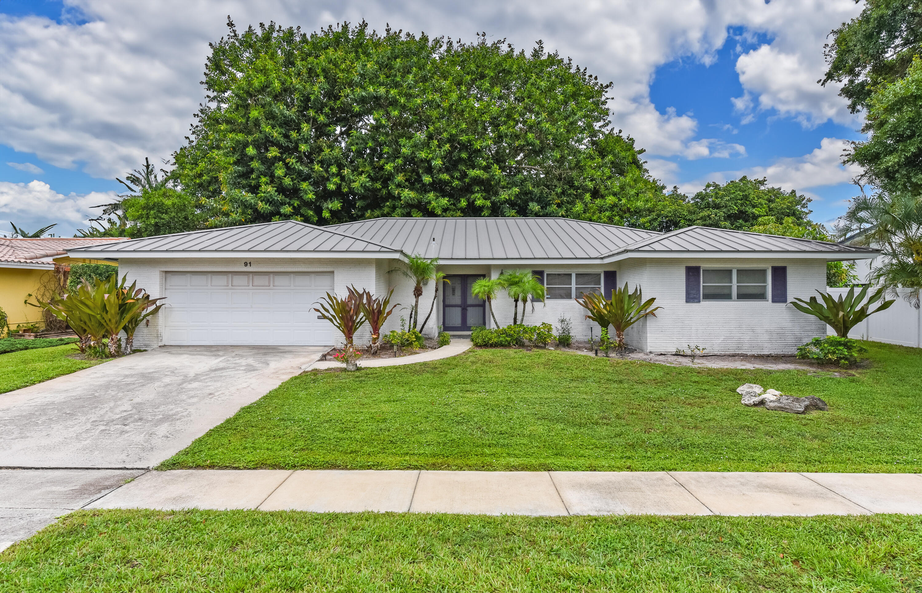 Charming single-story single-family home with excellent potential in Boca Raton's desirable Palmetto Park Terrace neighborhood! This home offers 2,236 square feet of living space with 3 full bathrooms and 4 spacious bedrooms often unseen in old Florida homes. Situated in a cul-de-sac on lake Martha and within walking distance to Addison Mizner school. Being sold as-is at $995,000 in need of updates, this property is a wonderful opportunity for buyers ready to personalize and modernize. Solid construction with a newer (2012) metal roof, and a functional layout, provide a great foundation to create your dream home in paradise. Conveniently situated in east Boca Raton, you're just minutes from beautiful beaches, vibrant downtown Boca Raton with its upscale shopping and dining at  Mizner Park, top-rated schools, parks, and easy access to major roadways. Enjoy a peaceful residential setting with water views. Sold strictly as-is. Buyers must perform all due diligence, inspections, and verifications. Square footage and features are approximate; please confirm with professional survey and appraisal. All information deemed reliable but not guaranteed.