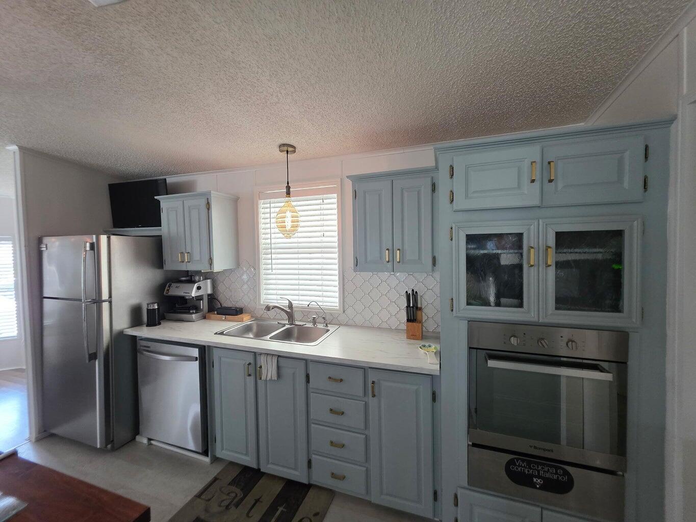 This two-bedroom, two-bathroom home is located in SPANISH-LAKES COMMUNITIES