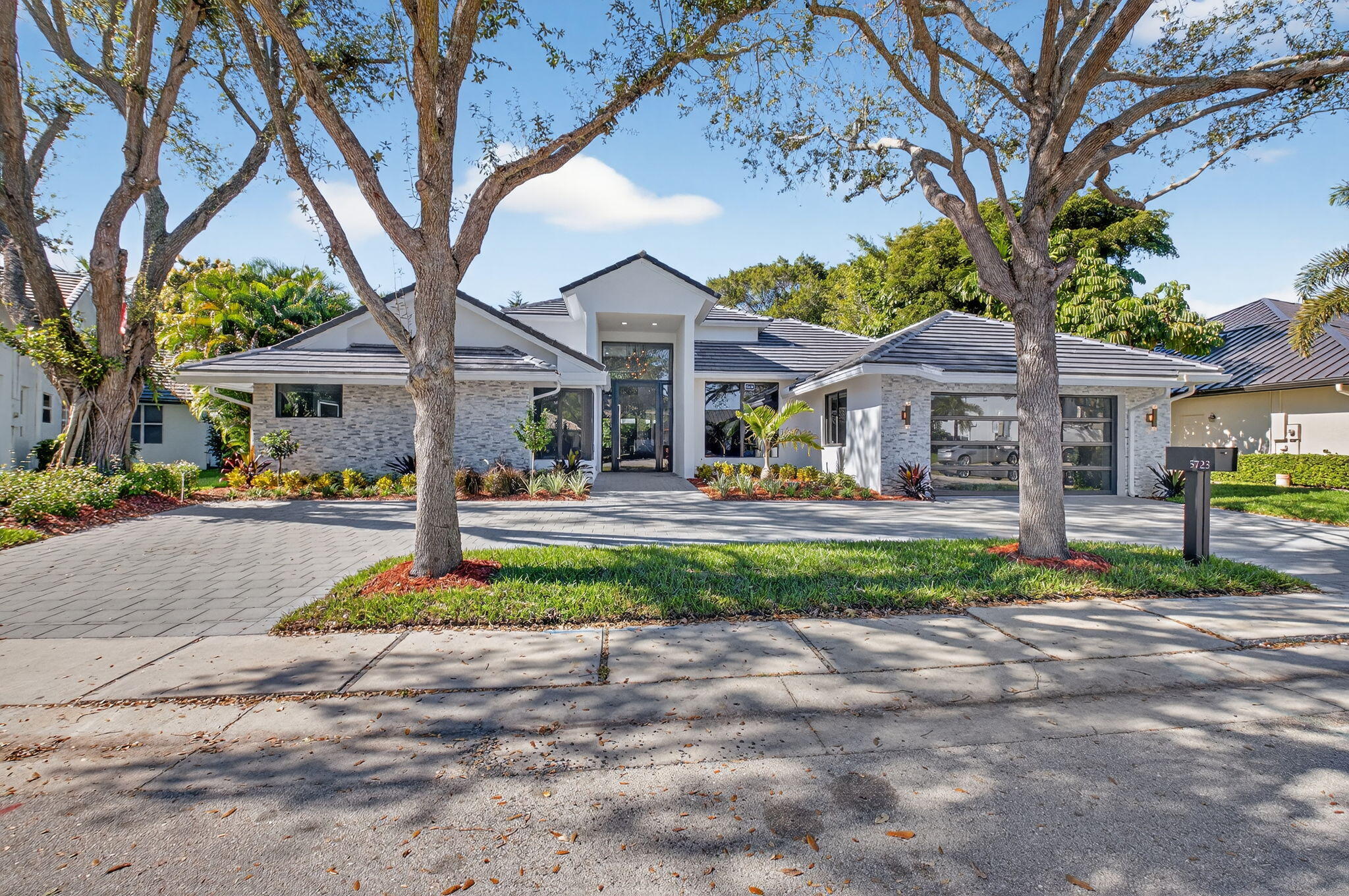 Exquisitely Renovated Luxury Estate in Prestigious Woodfield Country Club Community

This stunning 5-bedroom, 4.5-bath residence offers 3407 AC square feet of completely redesigned luxury living, featuring an extensive, top-to-bottom renovation with the finest materials, systems, and appliances—no detail overlooked.

The home showcases new high-quality hurricane-rated exterior doors and windows, a new hurricane roof, and a commercial-grade hurricane-impact double garage glass door for a 2 car garage, providing both elegance and peace of mind. A brand new generator, new gutters and leaders, and mostly redone plumbing further elevate the home's infrastructure. Inside, enjoy a fully redesigned floor plan highlighted by beautiful new engineered hardwood flooring, all-new interior doors, and all new electrical fixtures throughout. The gourmet kitchen is a chef's dream, featuring brand-new everything, including a Sub-Zero 30" refrigerator and 30" freezer, Wolf double oven, Wolf stove with Wolf vent hood, built-in Wolf microwave, and a Cove dishwasher. Full Bar set up with new built in sub zero wine refrigeration unit 


All bathrooms have been completely rebuilt with luxury finishes, including two specialty toilets with heated bidets. The primary living spaces flow seamlessly into a state-of-the-art home theater with new surround sound system with 4 brand new specialty lounge chairs electrically controlled lounge chairs. While remote-controlled electric blinds enhance all five bedrooms.

Outdoor living is equally impressive with new exterior pavers in both the front and backyard, a fully redesigned saltwater pool with and a heater system controlled by smart technology, plus new landscaping and sprinkler systemcreating a private resort-style setting.

Additional upgrades include:

New whole-house water filtration system

New laundry room appliances and custom design

One brand-new A/C unit and one 2022 A/C unit

The primary closets, his and hers, beautifully outfitted and organized..All closets have been professionally designed

Located within an exclusive Woodfield country club community, residents enjoy world-class amenities, and a premier South Florida lifestylejust minutes from beaches, upscale shopping, and dining.

This is a rare opportunity to own a truly luxury home where every detail has been thoughtfully curated for modern, elegant living.