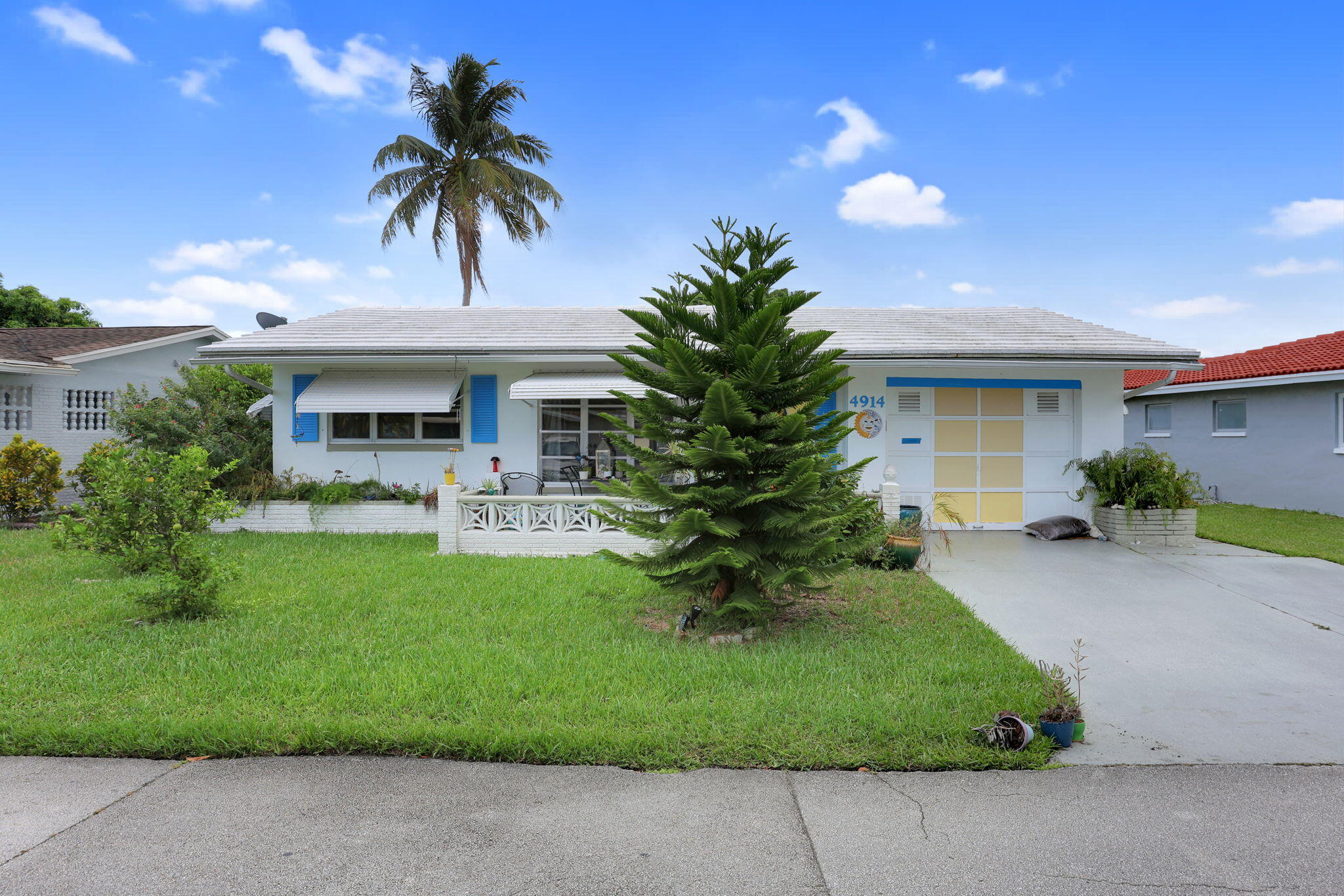 Classic Old Florida living in this charming home surrounded by a lush, tropical yard with your very own lemon and orange trees. Relax and unwind with canal views from the backyard, or enjoy the sunshine year-round in the bonus Florida room. Inside, the home exudes a vintage character with timeless details, and features no carpet for effortless style and easy maintenance. Mainlands of Tamarac includes a clubhouse and 2 pools. Low HOA fees and a great location right off the Florida turnpike!