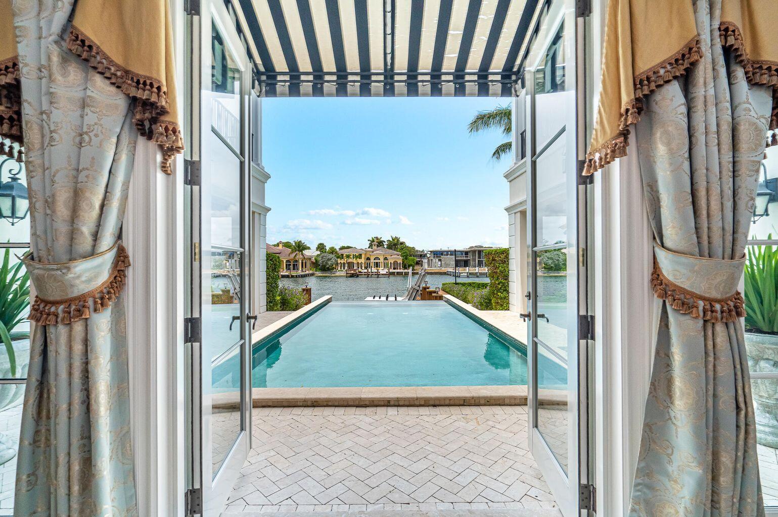 Rarely available Luxurious private gated WATERFRONT estate in Boca Raton's most prestigious enclave. Enjoy the South Florida lifestyle at its best with over 90+/-' of INTRACOSTAL Waterway. This is exclusive a one-of-a-kind custom home with 5-bedrooms/6 full and 3 half-bathrooms, gorgeous gourmet kitchen, ELEVATOR, INFINITY swimming pool and dock that will accommodate two vessels.