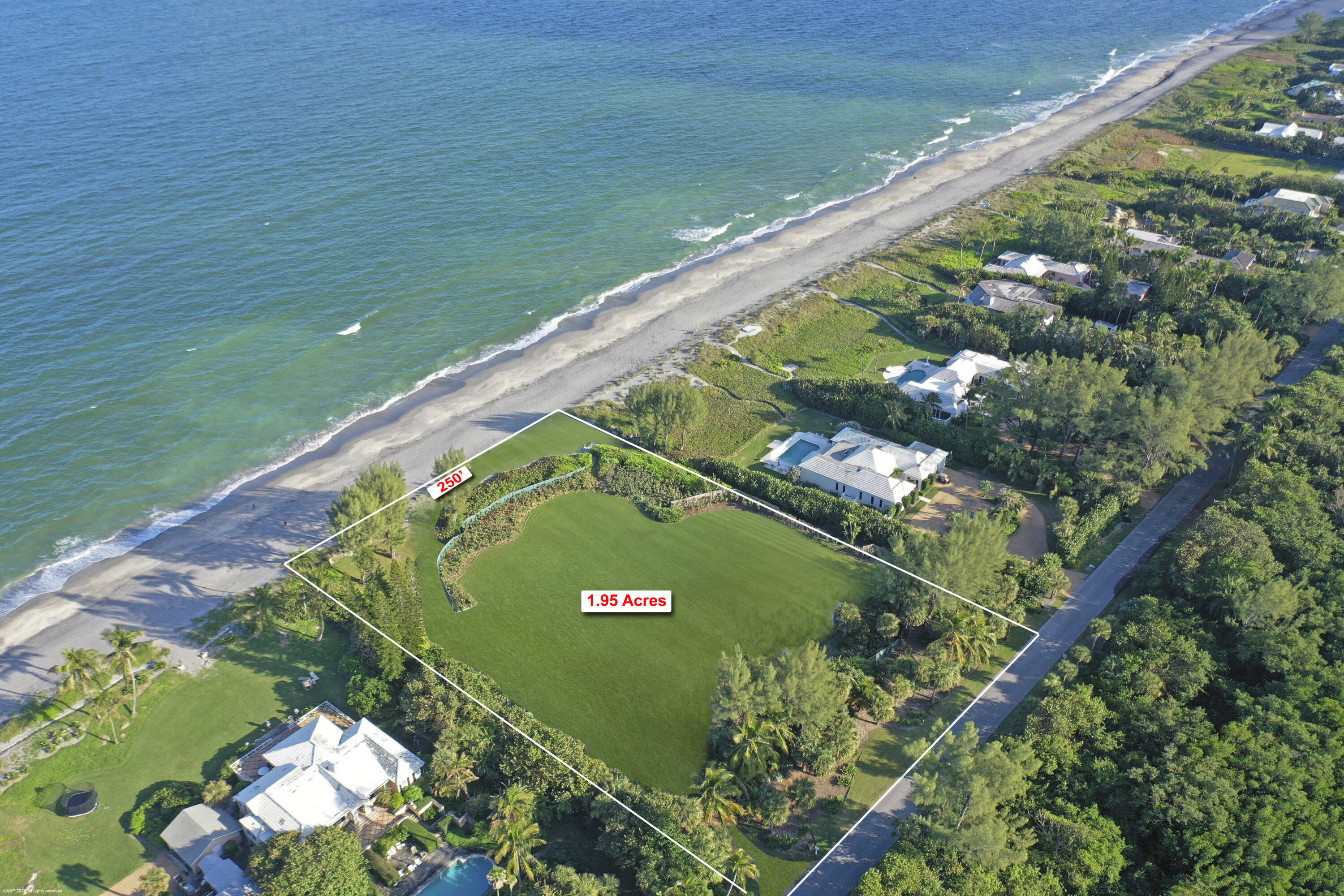 67 N Beach Rd is the largest oceanfront parcel available on Jupiter Island, This 2 acre lot with 250' of DIRECT OCEAN FRONTAGE has wide water views of the turquoise Atlantic.  Available total floor area of 10, 632 sq ft which cover a main house and several accessory buildings (guest cottage, pool house, garage) with tons of open space to install lush landscaping and seaside gardens. Plans designed by renowned architect Kevin Asbacher  have been approved by the Jupiter Island Building Dept or a Buyer could elect to build a house customized to fit their family's needs. The photos display the current structures that sit on the property and virtual images of the property after the buildings have been razed. The location near Bridge Rd provides quick access to shopping, restaurants and airport.