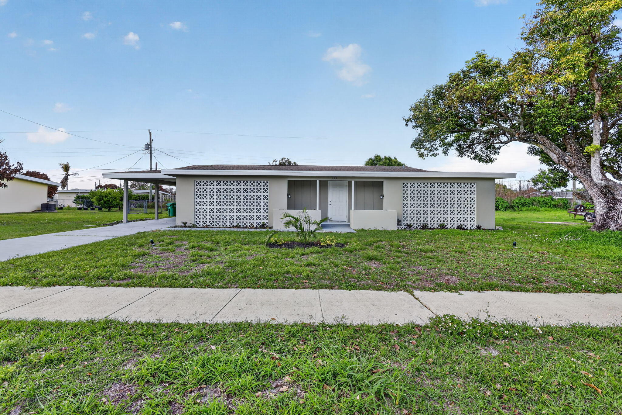 Beautifully renovated 3-bedroom, 2-bath home with an attached carport and spacious yard—perfect for relaxing or entertaining. The updated kitchen features white cabinetry, granite countertops, and stainless steel appliances. Both bathrooms have been stylishly upgraded with new vanities, tile, and modern fixtures. Enjoy new luxury flooring throughout, adding a fresh, cohesive feel to the home. Major updates include a 2019 roof and 2020 AC, offering peace of mind for years to come. Move-in ready and full of charm! Vacant and can show anytime, schedule on line. All offers must include seller's addendum-see attached. There is no seller's disclosure. All info deemed reliable but not guaranteed and should be independently verified. Property sold as-is. Owner is related to agent. This property qualifies for a mortgage rate buydown of up to 3%!​​‌​​​​‌​‌​​​‌‌​​​‌‌‌​​‌​​‌‌​​​​ -