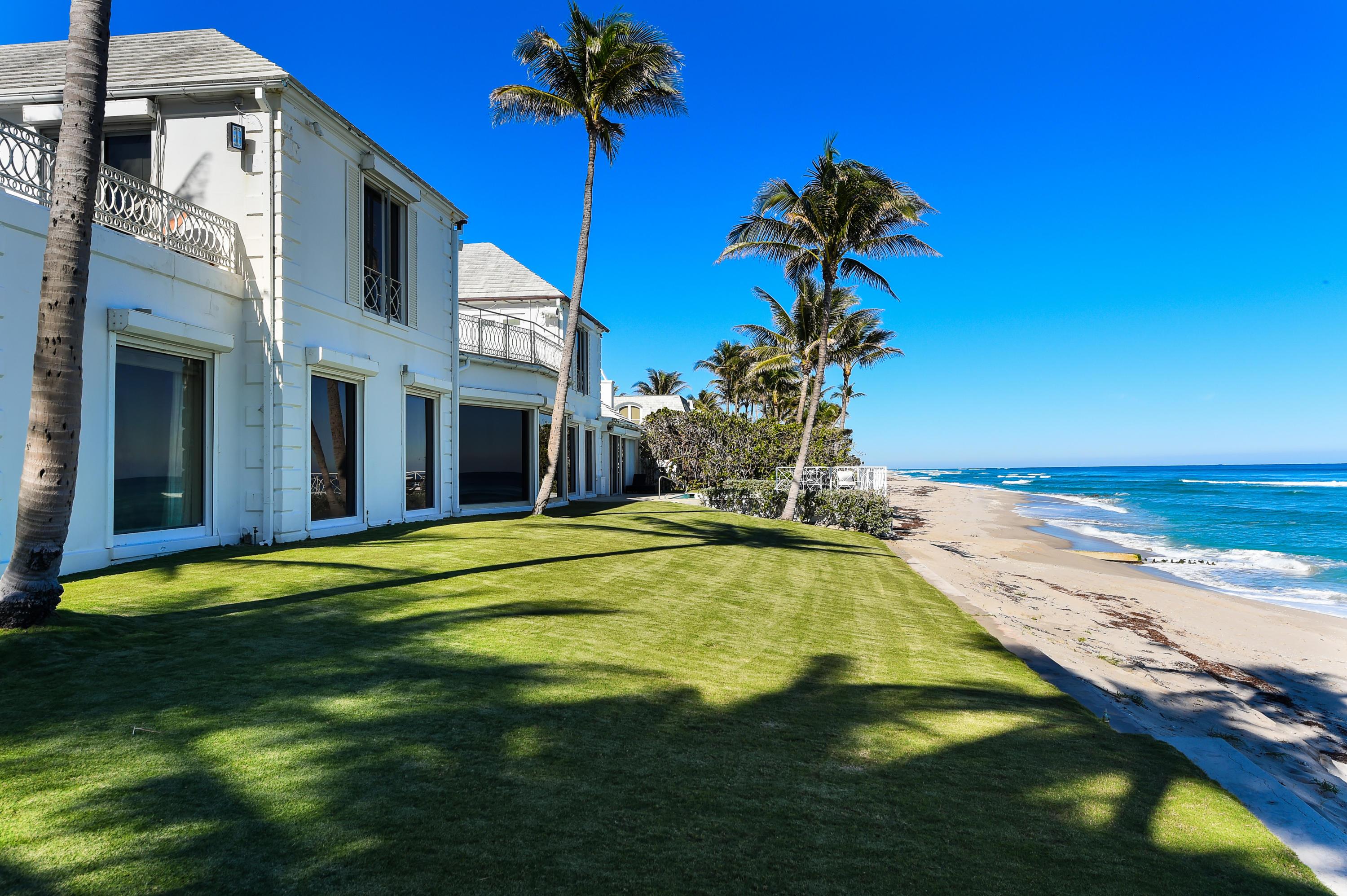 The Beachouse – Rare, direct oceanfront 8BR/8.3BA estate with commanding, in-the-sand ocean views. Fantastic Estate Section location at the foot of Woodbridge Road with 194 feet +/- of ocean frontage. Features open entertaining areas with formal living room, sun room, family room, and library. Gorgeous outdoor spaces with oceanfront balcony, patio, and pool.