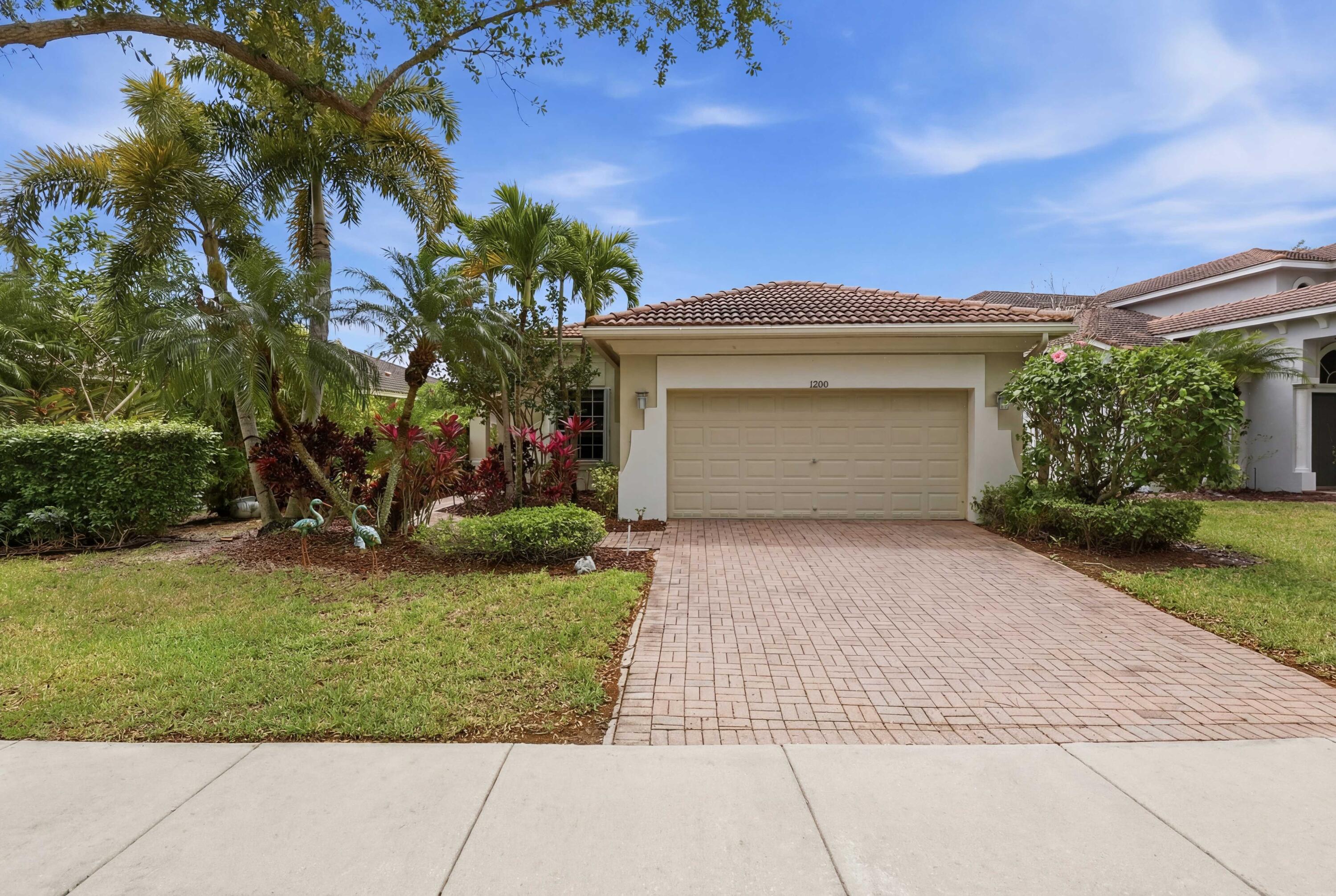 Reduced to sell! Upgraded 4/3/2 Heron Bay waterfront home. Relax and enjoy amazing long water views. Upgraded kitchen with granite counters, wood cabinets, newer appliances and backsplash. Eat in kitchen area. Wood floors in all bedrooms. Accordion Shutters. Updated AC. New EV charger in Garage. All 3 baths remodeled. Smart irrigation system. Split bedroom floorplan. Easy to show Welcome to your dream waterfront home in the highly sought-after Parkland community! Zoned for Parkland's premier, A-rated public schools, this immaculate 4-bedroom, 3-full-bath home boasts nearly 100k in recent and past upgrades. Step inside to find gorgeous engineered wood floors flowing through the living and dining rooms, seamlessly matching the brand-new wood floors just installed in all bedrooms.  The updated chef's kitchen features granite countertops, updated stainless steel appliances, a stylish backsplash, and a large center island perfect for entertaining. Retreat to the spacious primary suite, complete with a walk-in his and her closet and a breathtaking, completely redone en-suite bathroom featuring custom retiling and a luxurious brand-new shower. In fact, all three full bathrooms have been recently and beautifully updated to modern standards!  Practical features meet modern convenience with an updated A/C unit, accordion hurricane shutters, modern lighting and fans, and a 2-car garage newly equipped with an EV charger. Step out back to your covered patio to enjoy lush landscaping and sweeping waterfront views with beautiful sunsets.  Enjoy a maintenance-free lifestyle: the HOA covers landscaping, security systems and irrigation, plus access to 24-hour guard gates and two resort-style clubhouses featuring a heated swimming pool, spa, fitness center, tennis courts, and more. Conveniently located close to the Sawgrass Expressway, top-tier shopping, and restaurants. This move-in-ready gem won't last long!