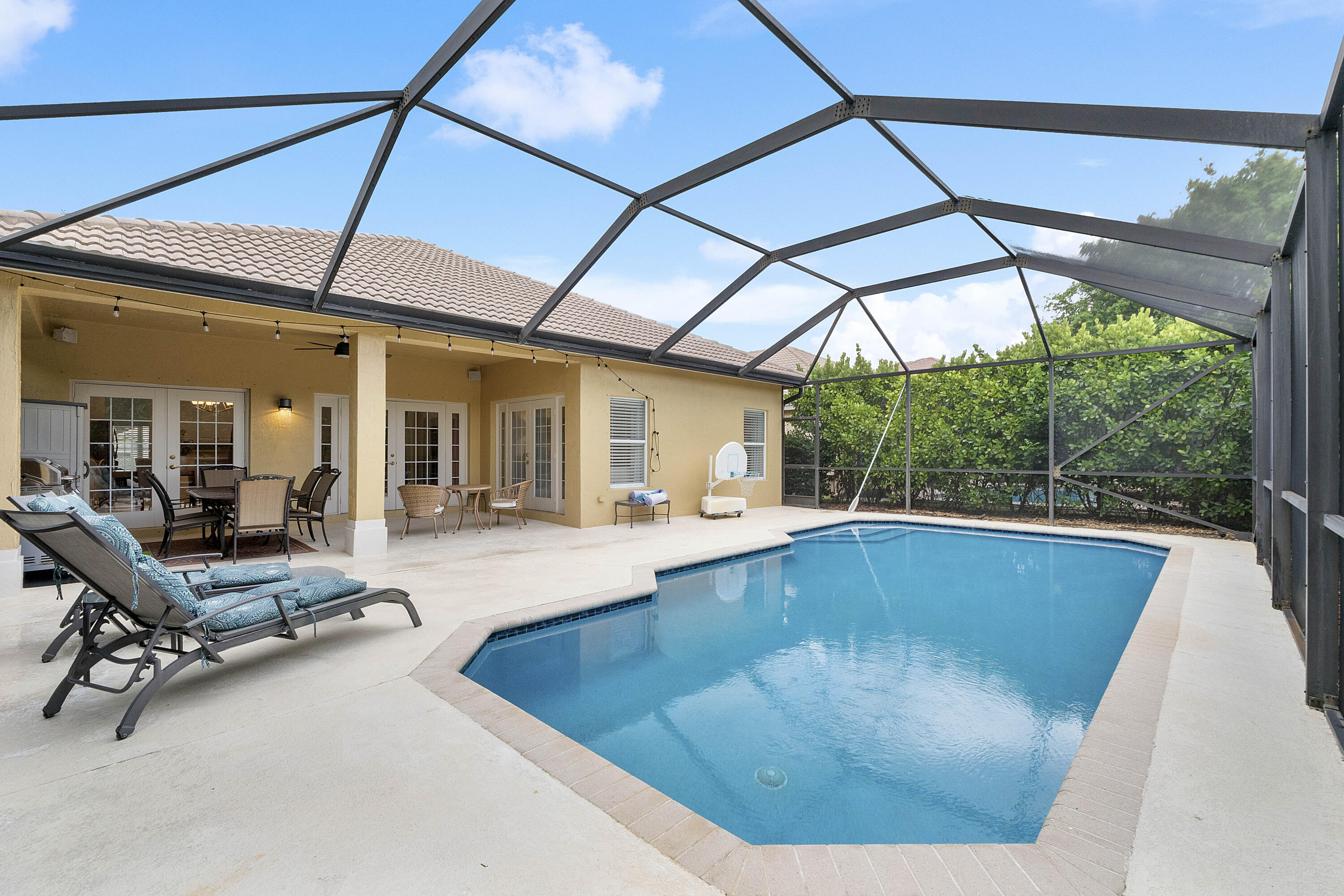 Come see this charming single story 3 beds 2 baths + den/office w/French doors & sparkling pool & peaceful screened in covered patio, surrounded by lush privacy landscaping in desirable Parkland Isles gated community! Two car garage w/ready to go generator & oversized driveway for 4 cars. Split floorplan w/wood floors in all bedrooms & tile throughout. Master has custom built in closets. Crown molding, high vaulted ceilings & natural light in open great room, perfect for entertaining! A/C 2022 w/new uvc blue lights, 2023 WH. Resort style community has heated swimming pool & spa, billiard room, fitness center, walking trails, playground, pickleball & tennis courts! Top rated Parkland schools!