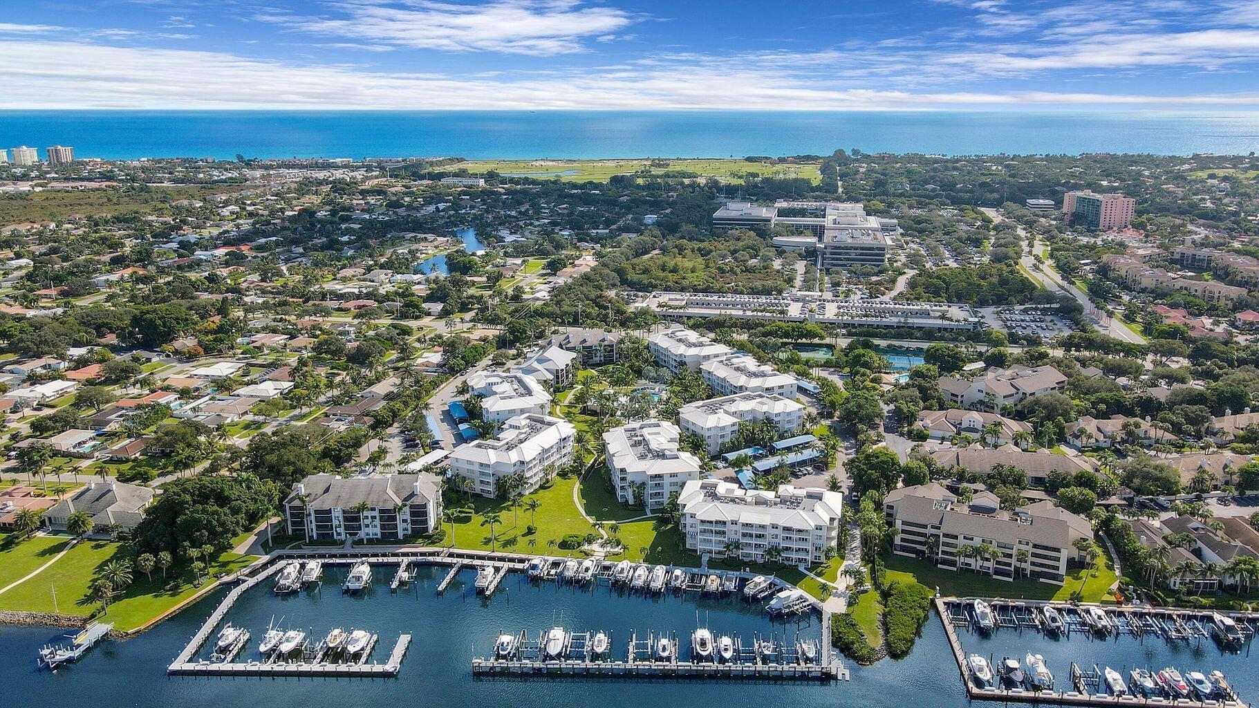 *AVAILABLE 7/1/26*Beautifully maintained 2-bedroom, 2-bath residence located in a sought-after Intracoastal community with marina access. This light and spacious condo features a welcoming foyer that opens to an upgraded kitchen with island counter and built-in office space. The enclosed balcony expands the great room and offers relaxing views of the pool and lush green space. The primary suite includes an upgraded bath, vanity, and generous closet space, while the guest bedroom also features an updated bath. Residents enjoy resort-style amenities including an oversized pool, spa, fire pit, clubhouse, fitness center, BBQ grills, and tennis/pickleball courts. Comes with 1 covered parking space and storage unit. Ideally located just a short walk or bike ride to the beach and minutes from   premier shopping, dining, and local attractions. Boat slip available for rent with the unit for an additional monthly fee.