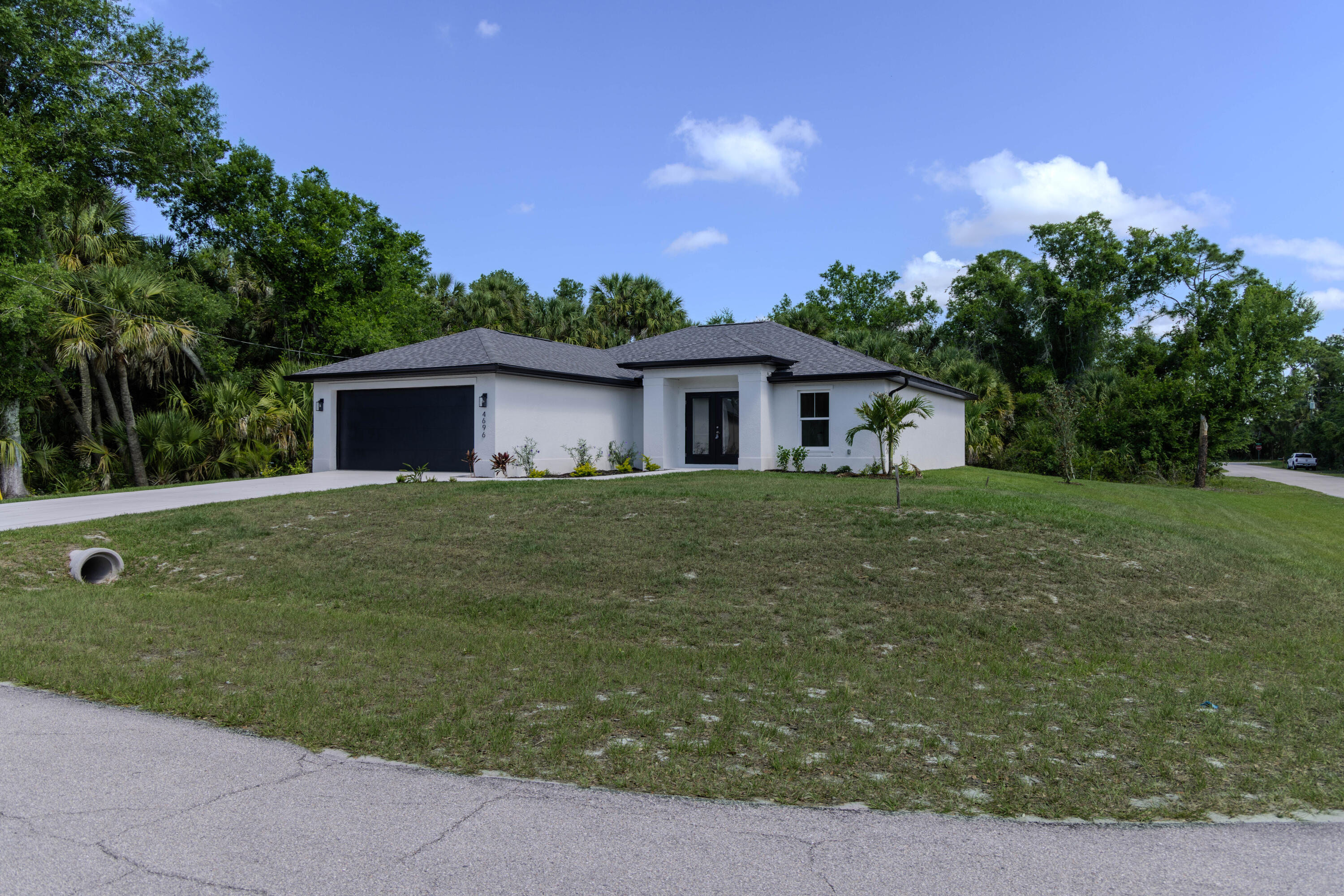 Brand-new construction corner home rental in North Port featuring 4 bedrooms, 2 bathrooms, and a 2-car garage with approximately 1,556 sq. ft. of living space. Open-concept split-bedroom floor plan with modern finishes throughout. Kitchen includes quartz countertops, shaker cabinets, stainless steel appliances, and a modern crystal pendant light over the breakfast bar. Interior laundry room adds convenience. Additional features include impact windows, luxury vinyl plank flooring, covered lanai, and spacious backyard. Convenient location close to Wellen Park, CoolToday Park, I-75, shopping, dining, schools, and Gulf Coast beaches. Pets considered case-by-case with owner approval. Income 2.5x rent, 600+ credit score, no evictions or rental collections. Not advertised on Craigslist.
