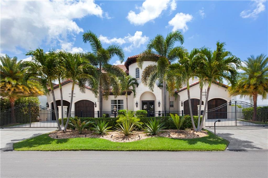 Spectacular Estate located directly on Intracoastal w/100' of water frontage & breathtaking wide water views. Chef's island kitchen w/walk-in pantry, formal dining, incredible master suite w/sitting area, steam shower w/2 shower heads & wet bar, upstairs family room w/huge covered terrace, 3 gas fireplaces. Perfect for entertaining, heated salt water pool, 2200 sq.ft. of outdoor living spaces, outdoor fireplace & summer kitchen. Hi-tech security, generator, 2 tankless water heaters, boat & jet ski lifts.