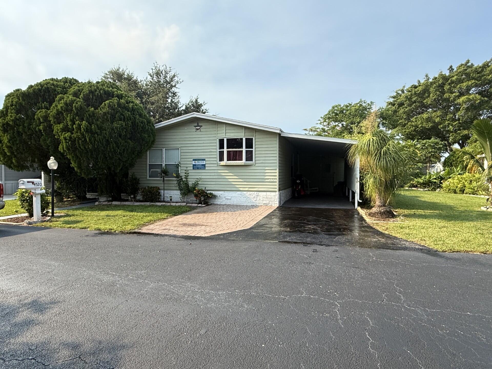 BEAUTIFUL HOME, WELL MAINTAINED WITH 3 BEDROOMS, 2 BATHS, AN ENCLOSED FLORIDA ROOM WITH A SEPARATE ENTRANCE, CENTRAL AC AND 5 CEILING FANS. HOME IS LOCATED IN DEERFIELD LAKE, A BEAUTIFUL 55+ COMMUNITY, ONLY A FEW MILES TO THE DESIRABLE BEACH OF DEERFIELD.  PERFECT FOR RETIREES.   LOT RENTAL $1,062.71 MONTHLY. IT CAN BE FINANCE.