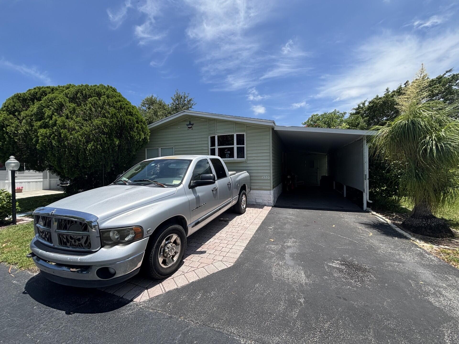 BEAUTIFUL HOME, WELL MAINTAINED WITH 3 BEDROOMS, 2 BATHS, AN ENCLOSED FLORIDA ROOM WITH A SEPARATE ENTRANCE, CENTRAL AC AND 5 CEILING FANS. HOME IS LOCATED IN DEERFIELD LAKE, A BEAUTIFUL 55+ COMMUNITY, ONLY A FEW MILES TO THE DESIRABLE BEACH OF DEERFIELD.  PERFECT FOR RETIREES.   LOT RENTAL $1,062.71 MONTHLY. IT CAN BE FINANCE.
