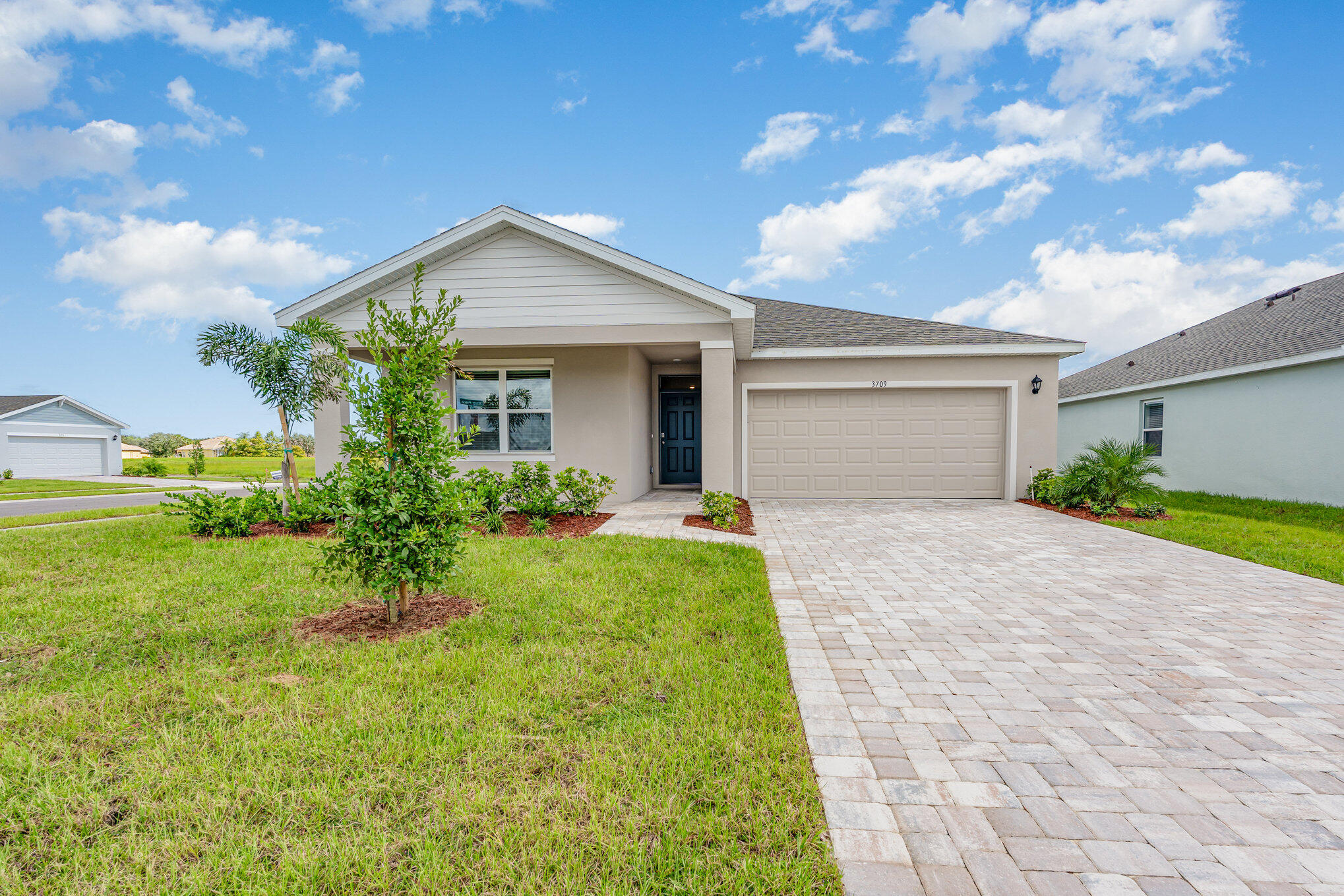 The Lakeside floorplan is an expertly designed multi-generational home that provides space, privacy, and seamless connection all under one roof. Featuring a layout with 5 bedrooms, 3 bathrooms, and a 2-car garage, this home offers a highly sought-after dual-living setup. This independent multi-gen zone is ideal for adult children, long-term guests, or a massive home office/studio setup with its own buffer from the main living areas. The main floor plan centers around a wide-open, expansive core where the living room, dining room, and kitchen connect harmoniously. Designed for hosting large gatherings, complete with a central island housing the dishwasher, a walk-in pantry, and a dedicated layout for appliances.