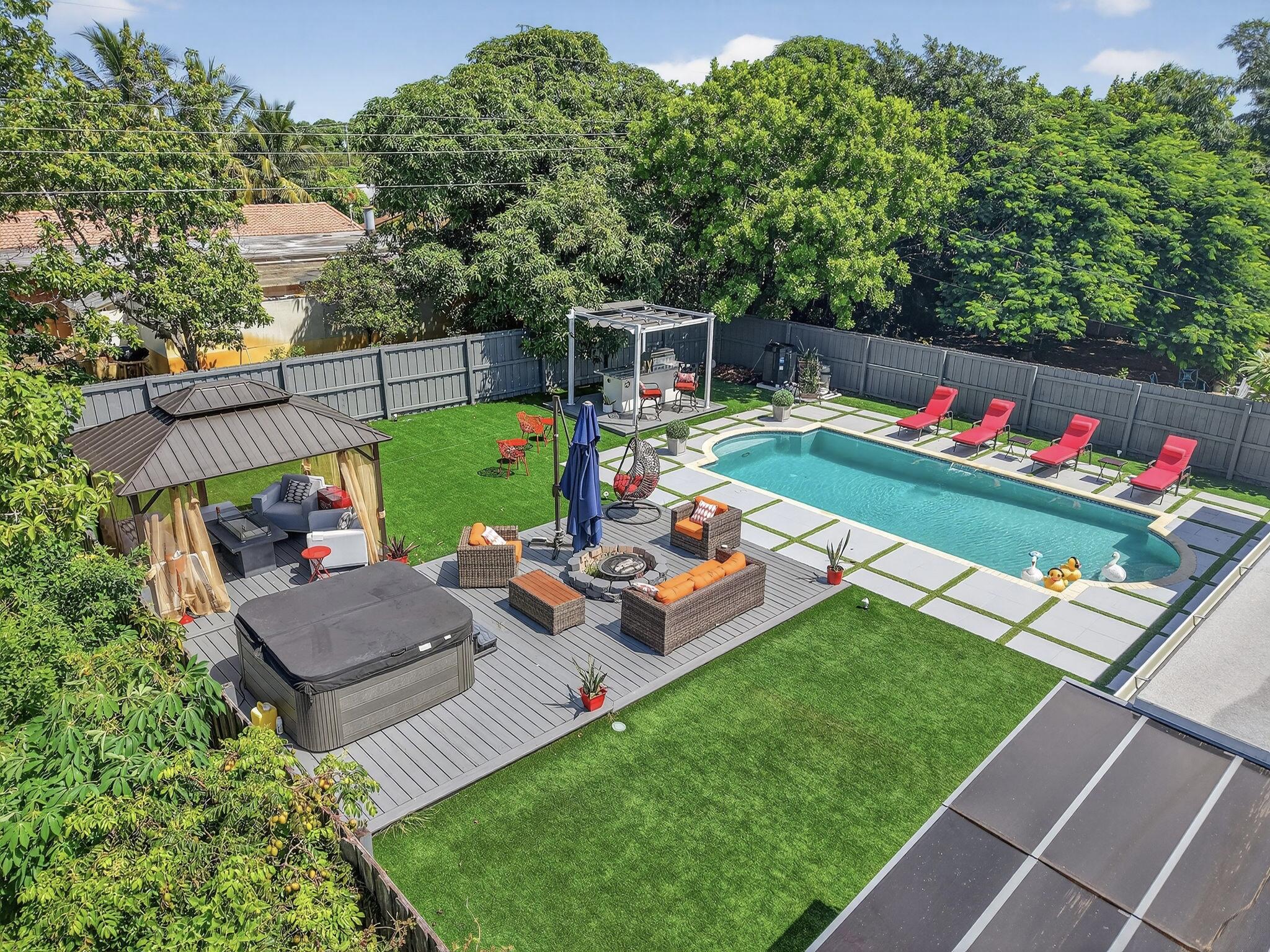 Completely renovated from top to bottom! This stunning 3-bedroom, 2-bathroom home offers modern finishes throughout and is move-in ready. Located in a desirable non-HOA community, you'll enjoy freedom and flexibility with no restrictions. The home features a private, fully fenced backyard oasis with a heated pool, fire pit, hot tub, patio for grill space, bar area and artificial grass, creating a very low maintenance outdoor space — perfect for entertaining or relaxing year-round. Conveniently situated with easy access to the freeway and just minutes from the beach, this property combines style, comfort, and prime location. Walking/Biking/Golf Cart distance from all that downtown Boynton Beach has to offer! This property could be ideal for investors. Furniture Negotiable.