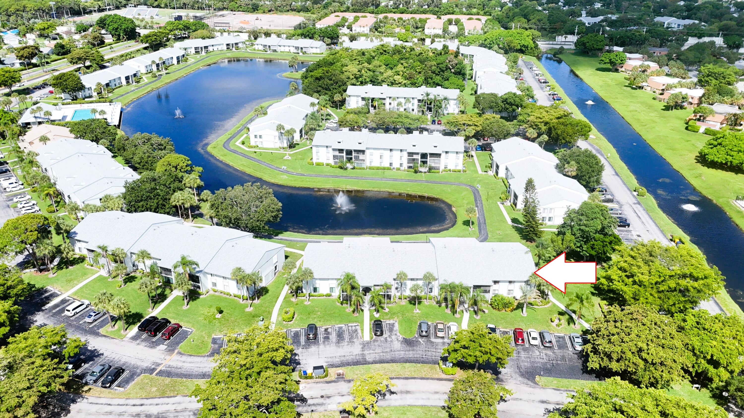 Welcome home to the gated community of The Palm Club! This spacious corner-unit condo offers 3 bedrooms, 2 bathrooms, and over 1,400 square feet of comfortable living space. Features include a newer A/C, an impact sliding glass door, and an open layout filled with natural light.  Residents of The Palm Club enjoy resort-style amenities, including a 24-hour manned gate, clubhouse, swimming pool, jacuzzi, and miles of scenic walking and running trails that wind around the community's beautiful lakes. Conveniently located near shopping, dining, major highways, and everything Palm Beach has to offer, this home is the perfect combination of comfort, security, and convenience.