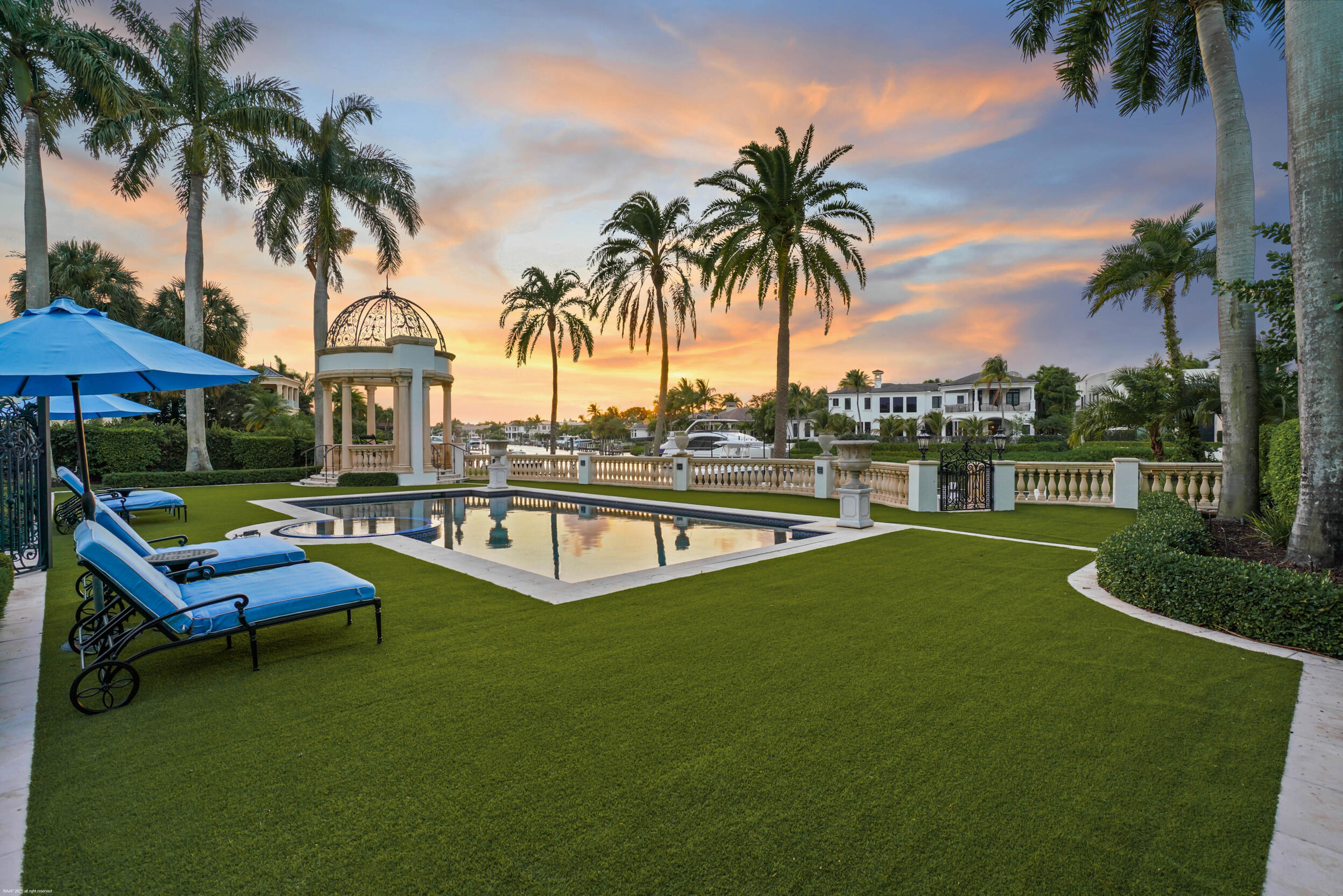 This extraordinary estate at 370 Eagle Drive feels like a Beverly Hills or Palm Beach mansion brought to Admirals Cove. Set on approximately 0.65 acres — significantly larger than most homesites in the community — the property also features over 14,000 square feet under air conditioning, creating an estate-sized feel that is almost impossible to replicate in Jupiter's luxury waterfront market. From the moment you arrive, the property makes a statement with dramatic architecture, expansive living spaces, and a layout designed for both large-scale entertaining and comfortable everyday living. Inside, the home features a private theater, grand entertaining areas, and an atmosphere that feels more like a private resort than a traditional residence. The outdoor living experience is equally  impressive, centered around a spectacular resort-style pool and backyard designed to enjoy South Florida living at the highest level. For boating enthusiasts, the property also includes a private dock with room for your boats and convenient access to the water. This is a rare opportunity to own one of Admirals Cove's most iconic luxury estates, combining oversized land and square footage with the exclusive waterfront lifestyle that has made Admirals Cove one of South Florida's premier luxury communities.