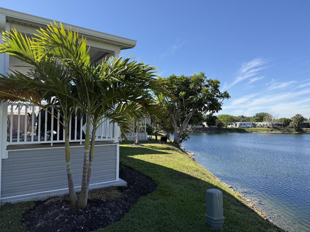 DON'T MISS THE OPPORTUNITY TO SEE THIS BEAUTIFUL HOME WITH 3 BEDROOMS, 2 BATHS, LARGE OPEN PORCH WITH WATER VIEW, OFFERING GREAT COMFORT AND SERENITY. IT HAS ALL THE SPACE FOR RELAXATION AND DELIGHTFUL. PERFECT TO SPEND TIME WITH FAMILY AND FRIENDS. HOME WAS BUILT IN 2023 WITH THE NEW HURRICANE STANDARD, HURRICANE IMPACT WINDOWS, 9 FOOT CEILING, TEXTURE WALLS, UPGRATED EXAUST SYSTEM-NO MOLD. CROWN MOLDING THOUGHOUT THE HOME AND ROOF IS TIEDDOWN.
HOME LOCATED IN A 55+ COMMUNITY,  ONLY A FEW MILES FROM THE DESIREBLE DEERFIELD BEACH, MAJOR AIRPORTS, HOSPITAL AND MORE. LOT RENTAL $1,111.00 MONTHY, INCLUDING WATER, SEWER AND TAXES.