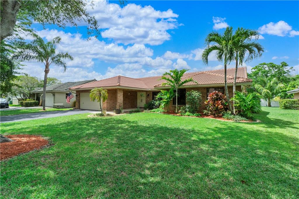 Own a Pool home in the Stoneman Douglas School zone and just a block from North Springs Park! Enjoy the Open floor plan and vaulted ceilings.  NO HOA! Large screened pool/bar for entertaining. 2007-Roof, 2016-AC, Hurricane Shutters & some impact windows. Big 1/4 Acre lot with Fruit trees and room to garden, play,etc.! New Granite Countertops/backsplash, Oak Cabinets, updated  bathrooms.  Close to shopping, best schools. OPEN HOUSE  SAT 6/18 11-3PM . Call/Text  for Weekday appointment.  Investors can rent immediately!