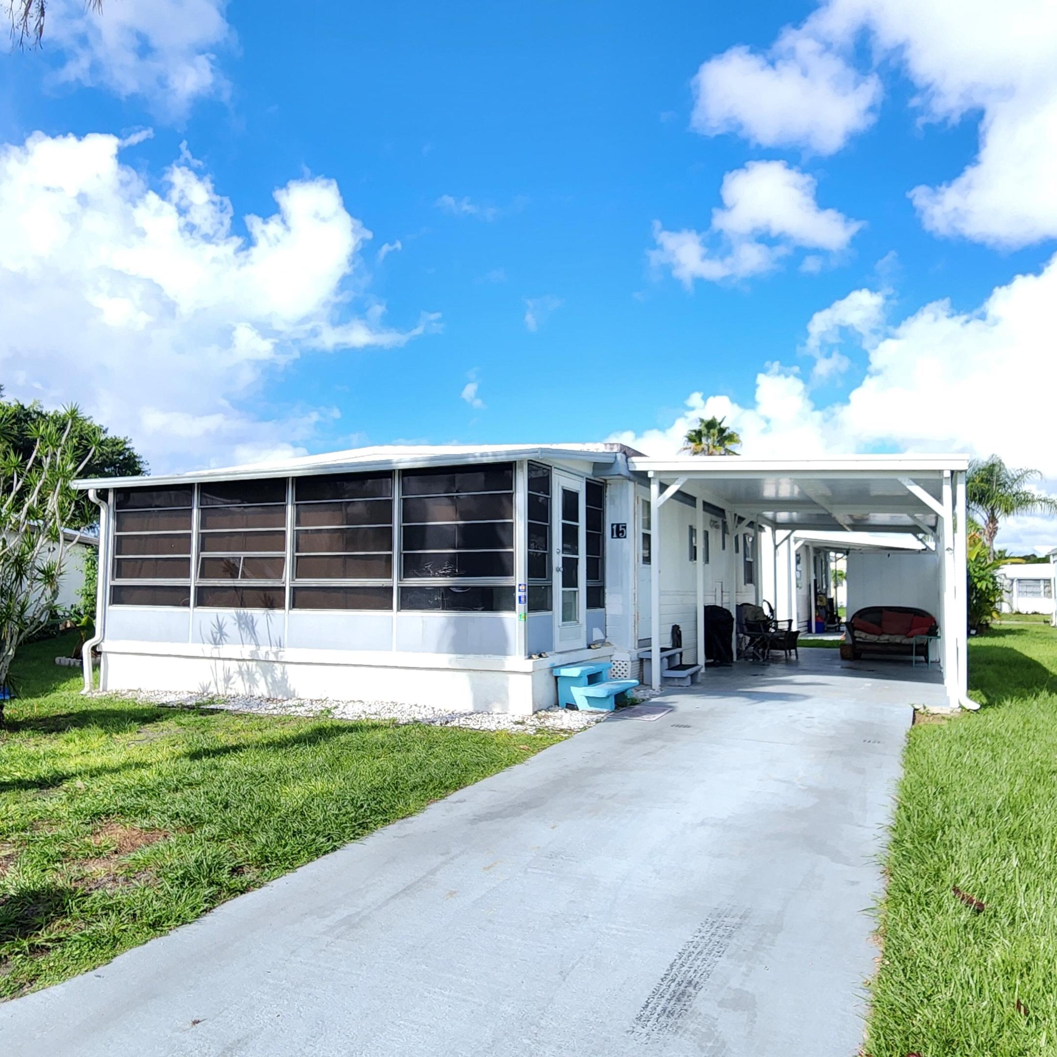 Brand NEW AC & roof was sealed/coated in 2022 in this charming 2 bedroom/1.5 bathroom on a cul-de-sac. Furnished home with a large Florida room perfect for a home office, 2nd living room, pet or plant room! Living room & guest bedroom flooring replaced.  Most notable is this home is nestled in a peacefully quiet, yet active, 55+ community. You will be pleased w/ this prime location; close to the beach, mall, grocery stores, shopping, post office, banks, pharmacies, hospitals & more. Lot lease of only 842.53 includes security, cafe, Clubhouse w/activities, lawn care, trash, free private golf course, bingo, heated pool, pickleball, tennis, workshop, shuffleboard, bocce, gym, library, cards, Mahjong, clubs & more! Grab your slice of paradise in the highly desired town of Port St Lucie!