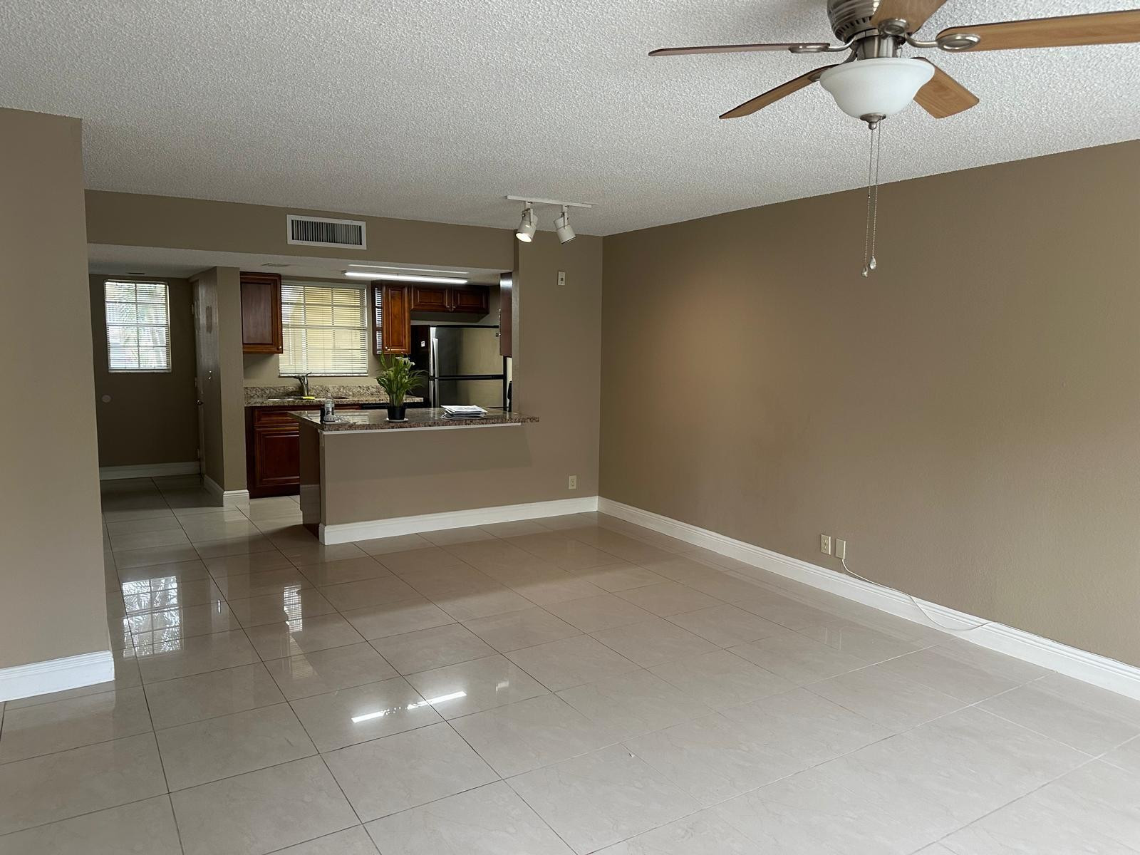 Bright and spacious updated unit featuring granite countertops, stainless steel appliances, and ceramic tile flooring throughout. The primary suite offers a large walk-in closet, and the unit includes a full-size washer and dryer for added convenience. Relax on the open balcony and enjoy the extra storage room. Rent requires only first month's rent and one security deposit. Resort-style community amenities include a pool, clubhouse, fitness center, tennis courts, and playground. Conveniently located near shopping, dining, and major highways.