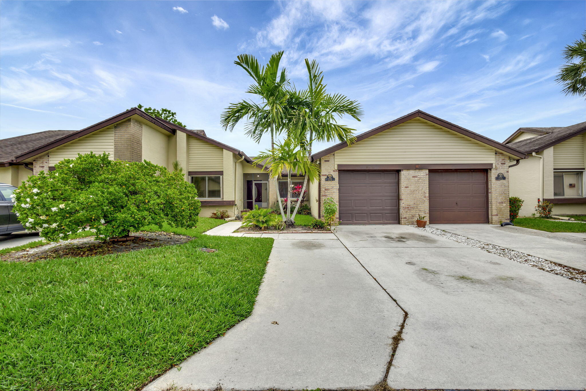 Charming 2 bedroom, 2 bathroom home located in a well-maintained 55 and better community with lush landscaping and tranquil surroundings. The kitchen features granite countertops, and the home includes a dedicated laundry room and a versatile room. Wood laminate and tile flooring are found throughout.  HOA includes roof, building insurance, exterior paint, lawn maintenance, cable TV, and access to a community pool. No Dogs - Cats OK