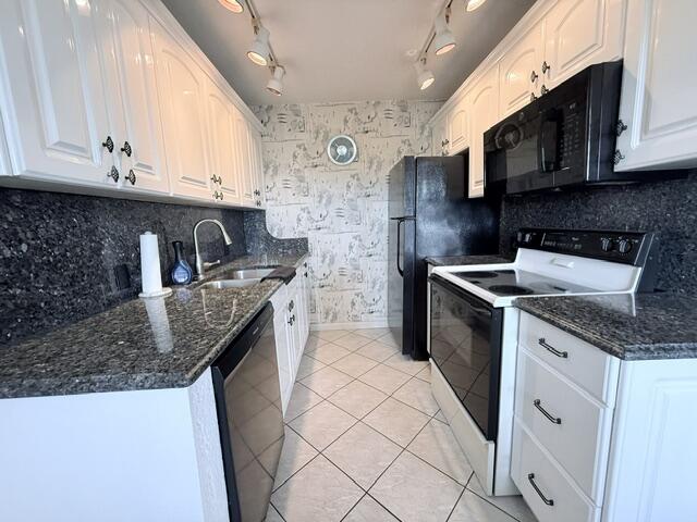 Welcome to this charming two-bedroom, one-and-a-half-bath condominium in the Harwood E Condo community in Deerfield Beach, Florida. Spanning 860 square feet. this waterfront property offers comfortable living with efficient space planning. The layout provides excellent separation of living areas, while the waterfront location adds distinctive character to your residence. This condominium presents an excellent opportunity for those looking for a move in ready place for the upcoming season. Century Village offers the finest in 55 plus amenities. Pickle Ball, tennis, fitness center, courtesy transportation, pools,shuffleboard,wood shop, clay room, stained glass workshop, art classes, theater and so much more! You'll love this place. This is a no-rental building.