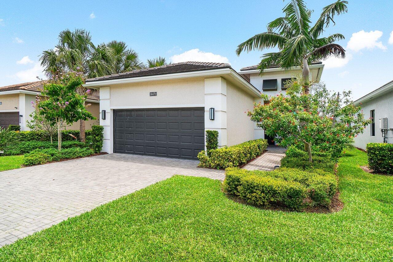 Don't miss out on this luxuriously appointed home in the highly sought-after Cresswind of Palm Beach +55 community.  This 2 Bedroom, 2 Bathroom plus Den Lido model will not disappoint. Positioned on the perfect lot, this home boasts breathtaking and unobstructed water views which can be clearly seen from the comfort of the patio while peering through the picturesque, panoramic view panel screen.  Inside you will find upgraded, modern decor throughout.  The kitchen is highly functional as well as beautiful, including soft-close cabinets, double ovens, a gas stove, a large pantry, and an eat-in table with great natural light exposure.  This home has plenty of storage with double walk-in closets in the primary suite and a 2 car garage. Cresswind offers wonderful amenities to lead an active and vibrant lifestyle, including a resort-style pool and spa, SmartFIT training center, Pickleball/Tennis, arts and crafts, dog park, and events room.  The Full time Lifestyle Director ensures that the Calendar is full of events that match all areas of interest.  Come take a look at this piece of paradise today.