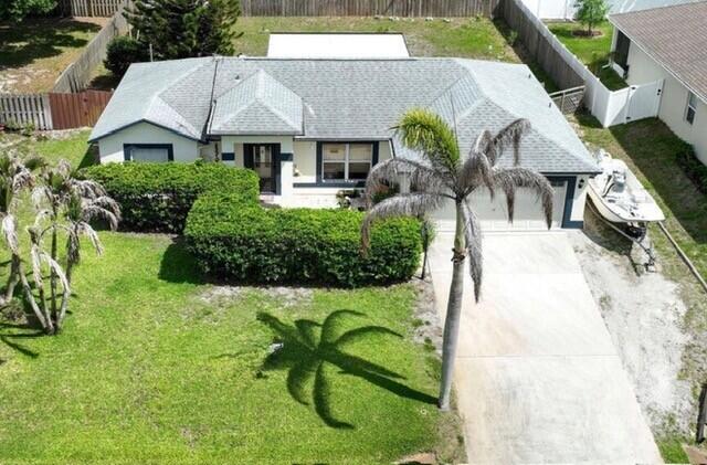 Welcome home! Check out this well kept charming 3 bedroom 2 bathroom home tucked in a quiet neighborhood. Big vehicle accessible fenced in backyard with a shed, firepit, and a screened in patio. Plus enough room to add a pool. Patio has a fan, lights and is ready for a TV and fridge. It's a great place to relax or entertain. Boat parking on the side of the house. Tall bushes in front for privacy. If you love to cook, this kitchen will make you smile. The bathrooms have been beautifully updated. Gorgeous wood like tile flooring. This house has an open and spacious floorplan.