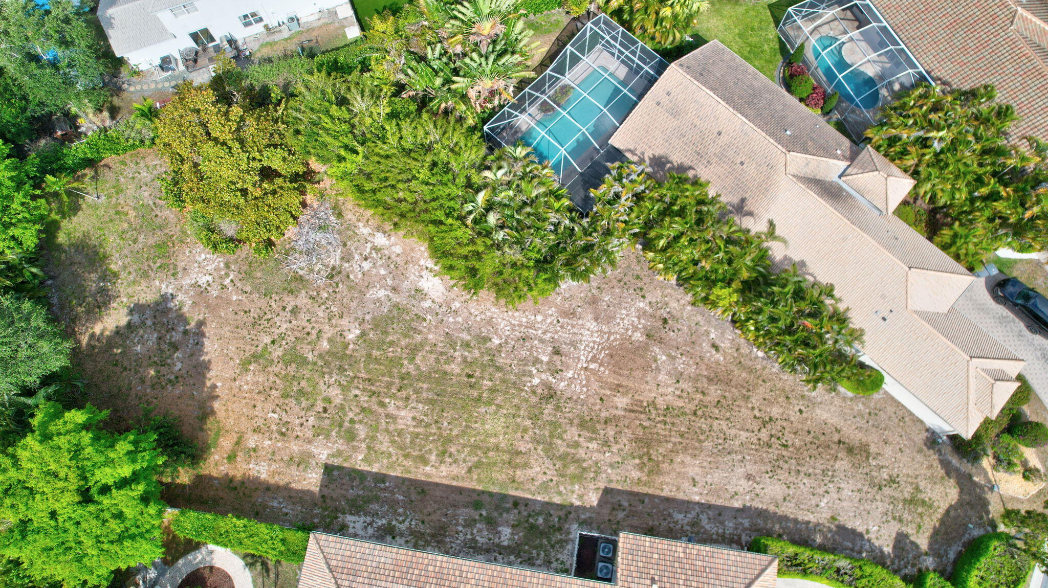 Motivated seller! Great opportunity to build a custom home in a gated community with all single family homes. This is the largest lot in the community. Almost the size of 2 lots. The home next door is also for sale.