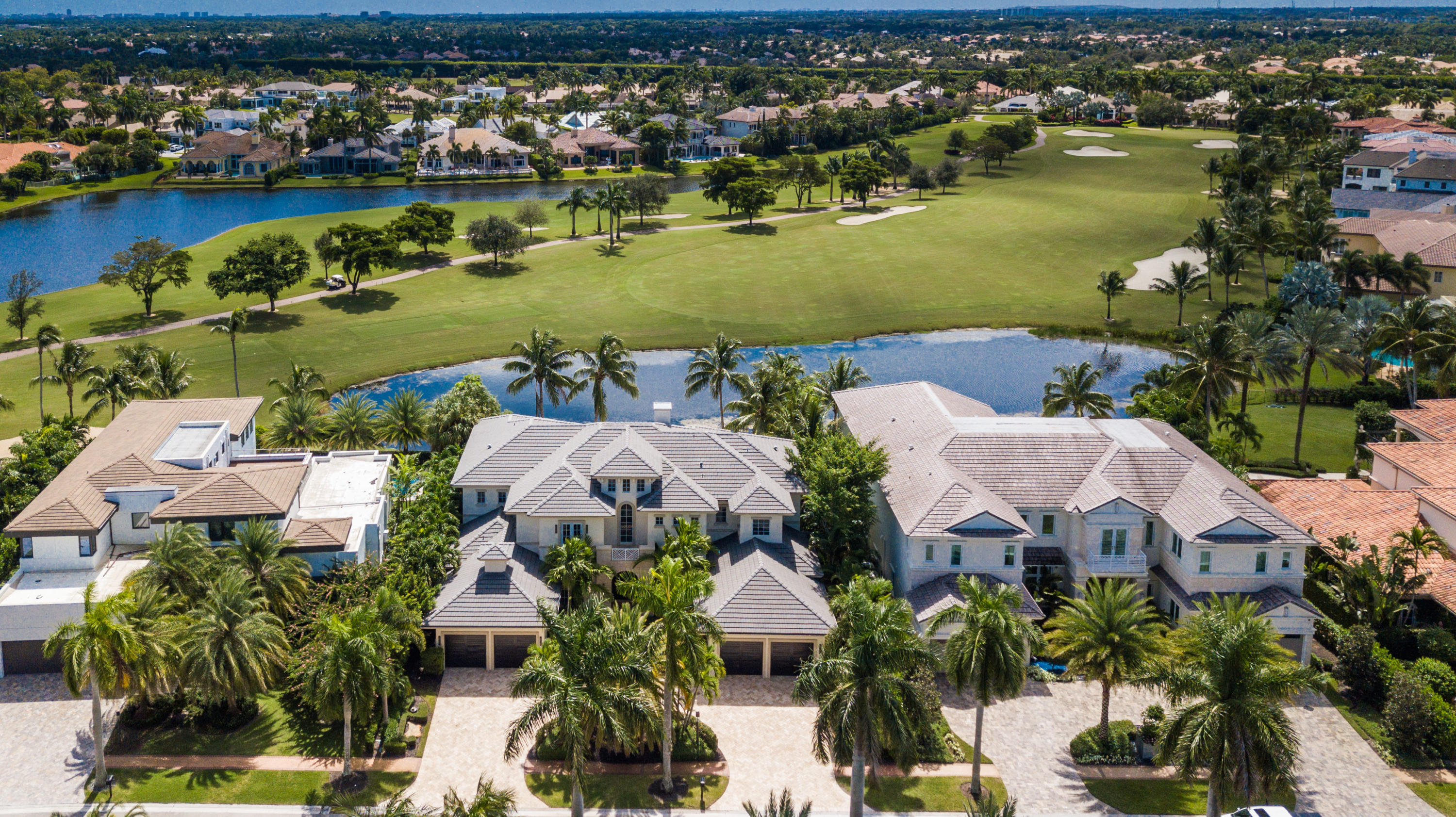This Transitional 5 bedroom, library, media and entertainment/loft residence in Grand Floridian style, has south exposure lake and rolling golf course vistas. An entry foyer opens to a two story living room with fireplace and optional bar, all with pool, patio views, in addition to a private office/library. The first floor master bedroom suite has exceptionally spacious walk in closets, separate bath rooms, accented with a two story light tower. A brand new full service kitchen with white hardwood cabinets, chrome cabinet and light fixtures, and white stone counter tops showcase by a center entertainment serving island, all transcend to a spacious family room and breakfast area, with exceptional pool, covered patio, lake and golf course views. A media, dining room, utility & dual double garages complete the first floor.The second level features hardwood floors in the public areas and full size entertainment loft area. Four bedroom suites, all with access to open sun-deck balconies have magnificent lake and golf course views, in addition to a full secondary utility room. 
Back to the first floor.. double family room doors open to a covered winter kitchen/bbq area with exterior television, and an open heated pool with spa and marble paver patio. A bermuda grass backyard is perfect for chaise lounge sun bathing overlooking lake and golf course views. Updated throughout, this home is in exceptional move in condition. A membership to St Andrews CC is required of all buyers at time of purchase and closing. Included in the monthly fee is a $50 per month assessment that is estimated to end in 2023.