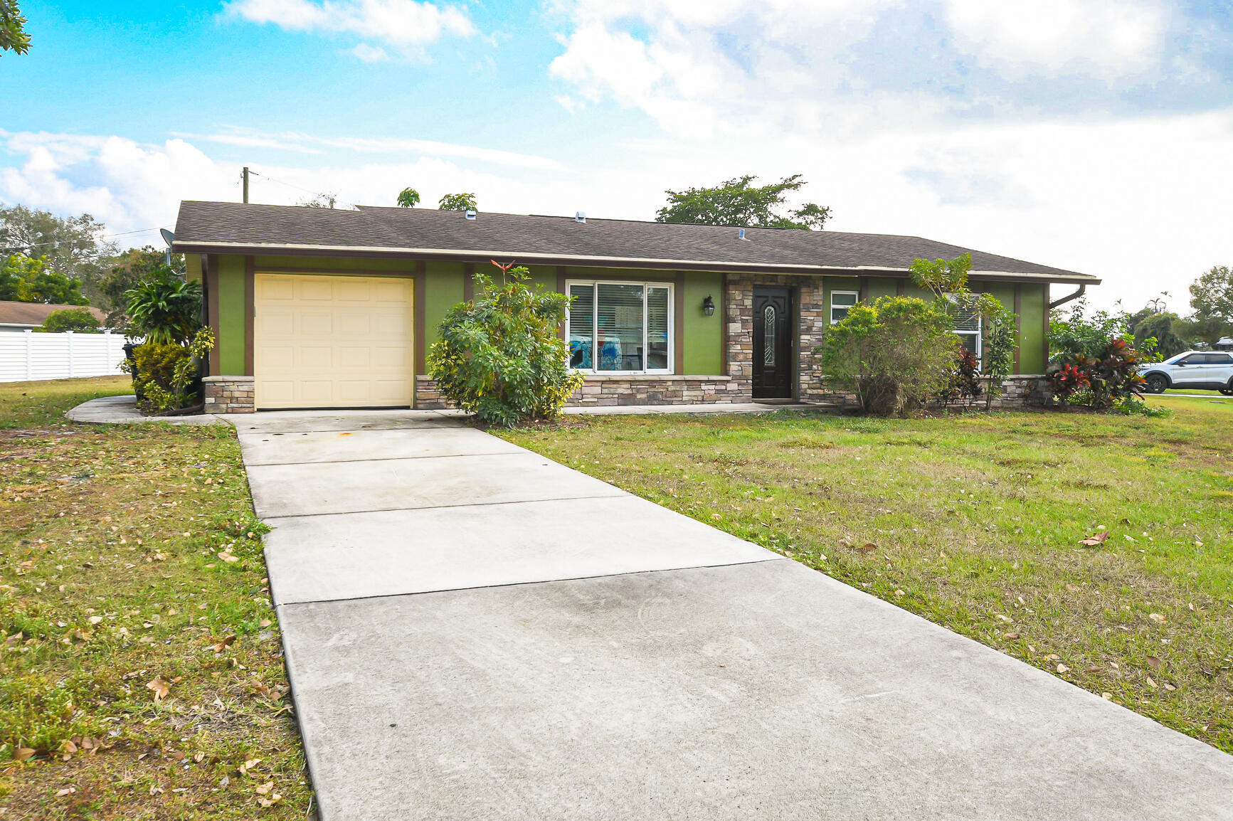 HOME SITS ON 1/3 OF AN ACRE BEAUTIFUL CORNER LOT! UPDATED EVERYTHING! IN THIS 2 BEDROOM/2 BATH/1CAR BEAUTIFULLY RENOVATED AND REMODELED FROM EXTERIOR TO THE INTERIOR. NEW HURRICANE IMPACT WINDOWS. NEWER ROOF,A/C, HOME SITS ON A GENEROUS APPROX OVERSIZED 1/3 ACRE CORNER LOT. NEW STONE WORK ADORNS THE OUTSIDE OF THIS CONCRETE BLOCK BEAUTY. KITCHEN WITH GRANITE COUNTERTOPS,CUSTOM WOOD CABINETS AND STAINLESS STEEL APPLIANCES. TILED THROUGHOUT FAMILY RM,KITCHEN AND DINING.BATHROOMS WITH GRANITE VANITYS AND TILED FLOORS. RELAX OUT ON YOUR SCREENED PATIO AND SIP YOUR LATTE IN THE MORNING OR DINE AL FRESCO IN THE EVENING! MOVE IN READY, BRING YOUR TOOTHBRUSH! CLOSE TO SHOPPING,SCHOOLS,CHURCHES AND PARKS!