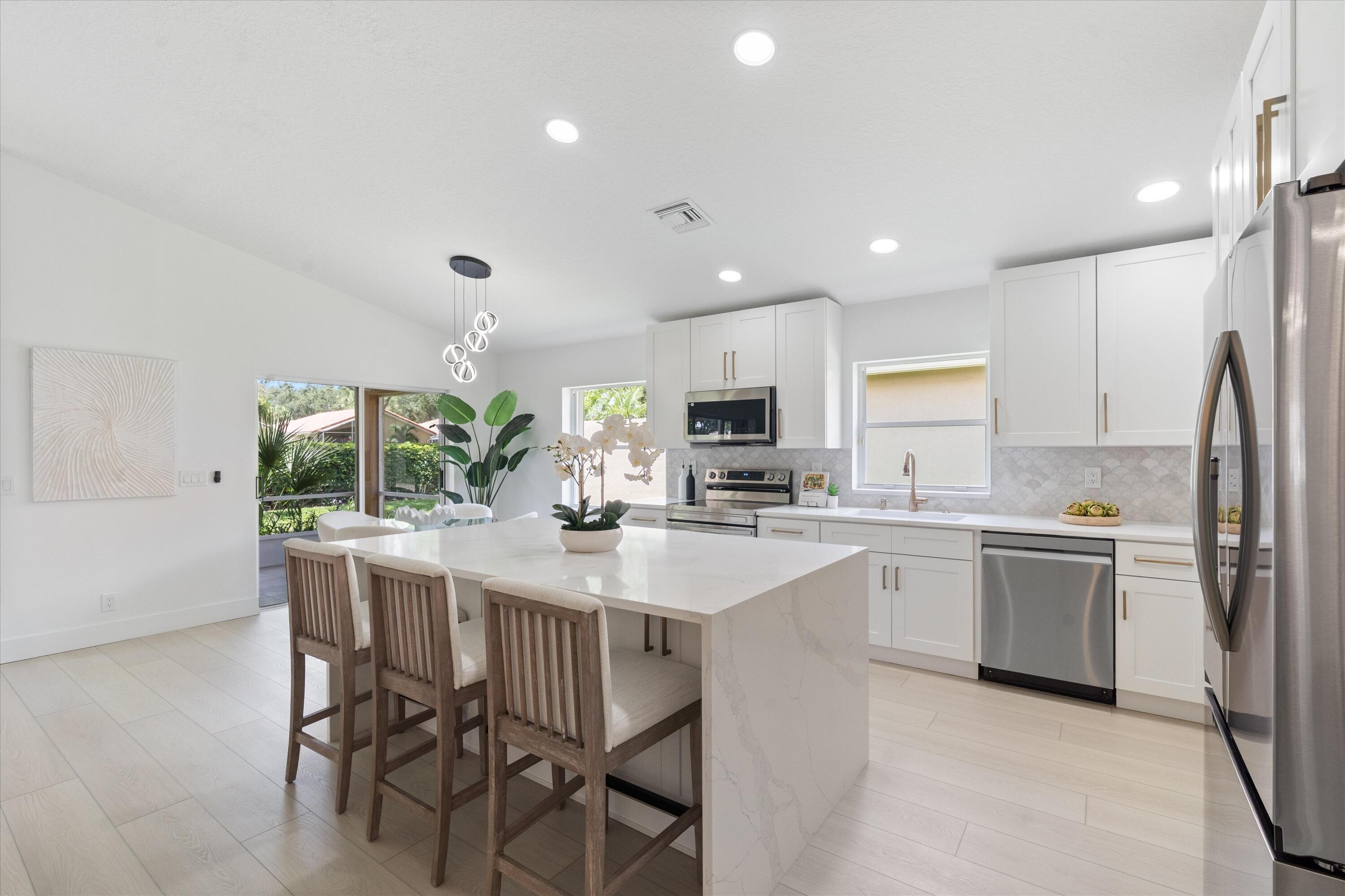 Beautifully renovated 3-bedroom, 2-bath home featuring a modern open floor plan and high-end upgrades throughout. This move-in ready property has been completely redone with brand-new appliances, a new A/C system, and a new hot water heater for peace of mind. The spacious layout offers seamless flow between the living, dining, and kitchen areas, perfect for entertaining and everyday living. Stylish finishes, updated fixtures, and abundant natural light make this home feel fresh, bright, and inviting. A perfect blend of comfort, style, and functionality.  Enjoy resort-style living in this vibrant community offering amenities and activities for every lifestyle. Residents have access to a beautiful clubhouse featuring a sparkling pool, pickleball courts, and a spacious social hall.