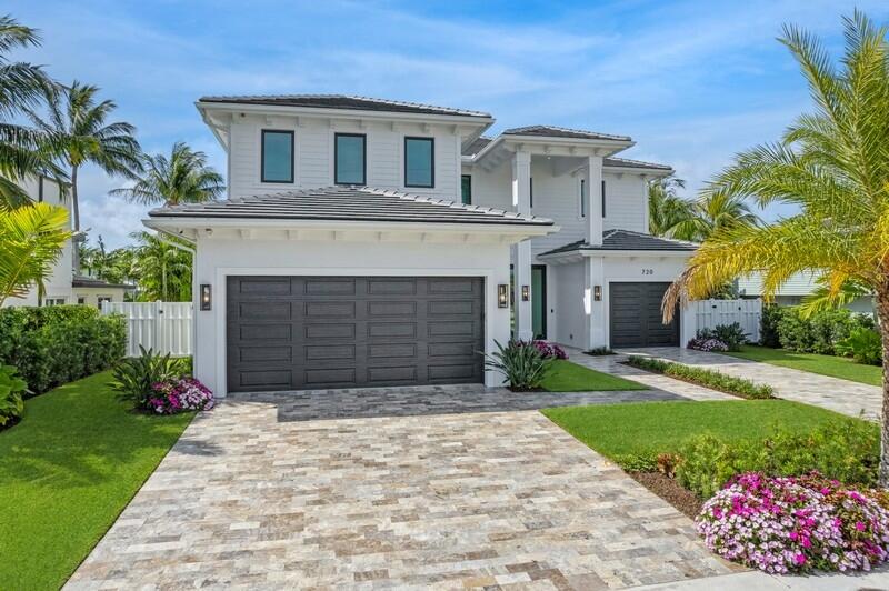 North Palm Beach Waterfront! An Immaculate 2022 Custom-Built Coastal Contemporary Luxury Estate with high-end finishes throughout. A boater's dream with 80ft of waterfront, a 60ft dock with composite decking, 20k lb lift, and a new seawall cap and retaining wall.  Located within 5 minutes of the blue waters of the Palm Beach Inlet and the Bahamas is only 50 nautical miles away.  The Estate Residence has 5 full bedrooms, 4.5 bathrooms, office, club room, private elevator, extended loggia with outdoor kitchen, a heated saltwater pool and 3-car garage.  The open-concept kitchen would easily house any chef with top-of-the-line appliances including paneled SubZero refrigerator and freezer, 5 burner custom LaCanche range, 2 Viking Dishwashers, an oversized pantry, and large kitchen island. This bright and open home offers sunny southern exposure with wall-to-wall 10ft impact sliders opening to the covered lanai and pool area.  The master suite includes oversized his and her walk-in closets, a spacious bathroom with dual shower and soaking tub, finished in the highest quality marble and quartz.  Additional luxury features include: Designer lighting, 12 ft coffered ceilings, custom built ins throughout, bar area w/ 2 beverage coolers & wine coolers, summer kitchen, heated saltwater pool and spa, synthetic turf backyard, and white marble decking.   Concrete block home with gypcrete soundproof floor on second floor, 2 a/c units, icynene insulation, Pad and gas hook up for full house generator.