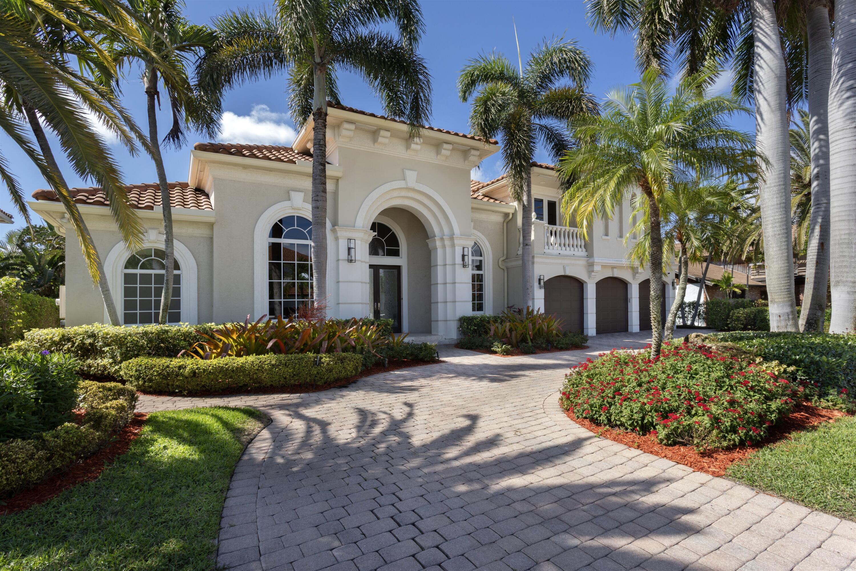 Escape to paradise at this stunning waterfront residence, with serene water views everywhere, on sought-after Tropic Isle in vibrant Delray Beach! Landscaped back yard with privacy hedges on each side sequester the pool with an overflow spa set within a large stone pool deck, with loggia just adjacent.  A plus for watersport enthusiasts, this southern-exposure property has 90-feet on a deepwater wide canal and a dock, with no-fixed-bridges, easy access to the ocean.  Detail include 14-foot vaulted ceilings on the first floor, marble, tile and wood flooring, attractive custom moldings, updated bathrooms and a wonderful four-bedroom, 3672 sq foot floor plan perfect for entertaining and family living. Hyacinth Drive, Delray Beach, Florida. Tropic Isle, a desirable yachting community fronting the Intracoastal Waterway with a yacht harbor and deep-draft canals, is located just minutes from the ocean beach at Atlantic Dunes Park and famous Atlantic Avenue in vibrant downtown Delray Beach, known for its shopping, dining, and entertainment venues.  PROPERTY:  In the tropically landscaped fenced back yard, the loggia overlooks the pool with a waterfall spa set within an expansive patio inviting relaxed outdoor living and entertaining. With 90-feet on a wide deepwater canal and a dock, boaters enjoy no-fixed-bridges easy access to the ocean.  RESIDENCE:  Welcome to paradise at this stunning custom residence in coveted Tropic Isle, where serene water views set the stage for enjoying luxury South Florida living at its finest. Soaring 14-foot ceilings, refinished marble tile flooring, built-in custom cabinetry, handsome moldings and window-walls of glass combine to create a clean modern aesthetic sure to please the discerning owners. The formal living room is crowned with a dramatic designer ceiling, while a bar in the dining room makes entertaining effortless. For more informal gatherings, the great room adjoins the kitchen, featuring white cabinetry that contrasts with striking black granite counters. As a work hub or private study, the office, with rich cherry-wood custom cabinetry and flooring, is conveniently located next to the primary suite in the split bedroom-plan. Spacious, bright and freshly painted and featuring a pocket-door entry and handsome new wood flooring, the water-view bedroom serves as a tranquil retreat, comprising a large custom-fitted closet and spa-inspired bathroom with double sinks set within custom cabinetry, a large walk-in shower and freestanding soaking tub. Upstairs are three guest bedrooms, with one opening to a private balcony overlooking the water. Completing the layout of this four-bedroom, 3672± square-foot residence are a powder room, cabana bath, laundry and three-car garage. Of note, all bathrooms were recently renovated, complete with designer appointments, while new amenities throughout include indoor and outdoor lighting, ceiling fans and a Challenger electrical panel. The roof and an air-conditioner were replaced in 2023, with additional conveniences that include a central vac system and a whole-house water filtration system. Don't miss this exceptional offering, a rare beauty in one of Delray Beach's most desirable locations, defined by a timeless design that  extends a connection to the outside from almost every room along with many upgrades and every amenity in exacting perfection.  DISCLAIMER: Information published or otherwise provided by the listing company and its representatives including but not limited to prices, measurements, square footages, lot sizes, calculations, statistics, and videos are deemed reliable but are not guaranteed and are subject to errors, omissions or changes without notice. All such information should be independently verified by any prospective purchaser or seller. Parties should perform their own due diligence to verify such information prior to a sale or listing. Listing company expressly disclaims any warranty or representation regarding such information. Prices published are either list price, sold price, and/or last asking price. The listing company participates in the Multiple Listing Service and IDX. The properties published as listed and sold are not necessarily exclusive to listing company and may be listed or have sold with other members of the Multiple Listing Service. Transactions where listing company represented both buyers and sellers are calculated as two sales. "No payments made until title passes" Some affiliations may not be applicable to certain geographic areas. If your property is currently listed with another broker, please disregard any solicitation for services. Information published or otherwise provided by seller, listing company or its representatives is deemed reliable but are not guaranteed and subject to errors, omissions, or changes without notice. Copyright 2026 by the listing company. All Rights Reserved.