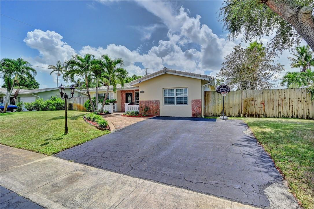 Remodeled 3/2 home in South Coconut Creek. Kitchen features Granite countertops, Stainless Steel appliances, and wood cabinetry. Wood laminate flooring throughout the entire house except for the tiled bathrooms. Roof 2012. Smooth Stove top 2021. Dishwasher 2020. Water heater 2017. Sprinkler system that runs off personal well. Accordion hurricane shutters. Ceiling fans in all bedrooms. Home alarm system on all doors/windows. Accordion shutters with some panels. Huge Oversized Lot with playground and storage shed. 30’ x 10’ covered porch with wooden ceiling, Mexican tile floor, and ceiling fan. Gutters. Great schools and 4 amazing parks all within walking distance. NO HOA! Available to be shown starting on Saturday, September 11th.
