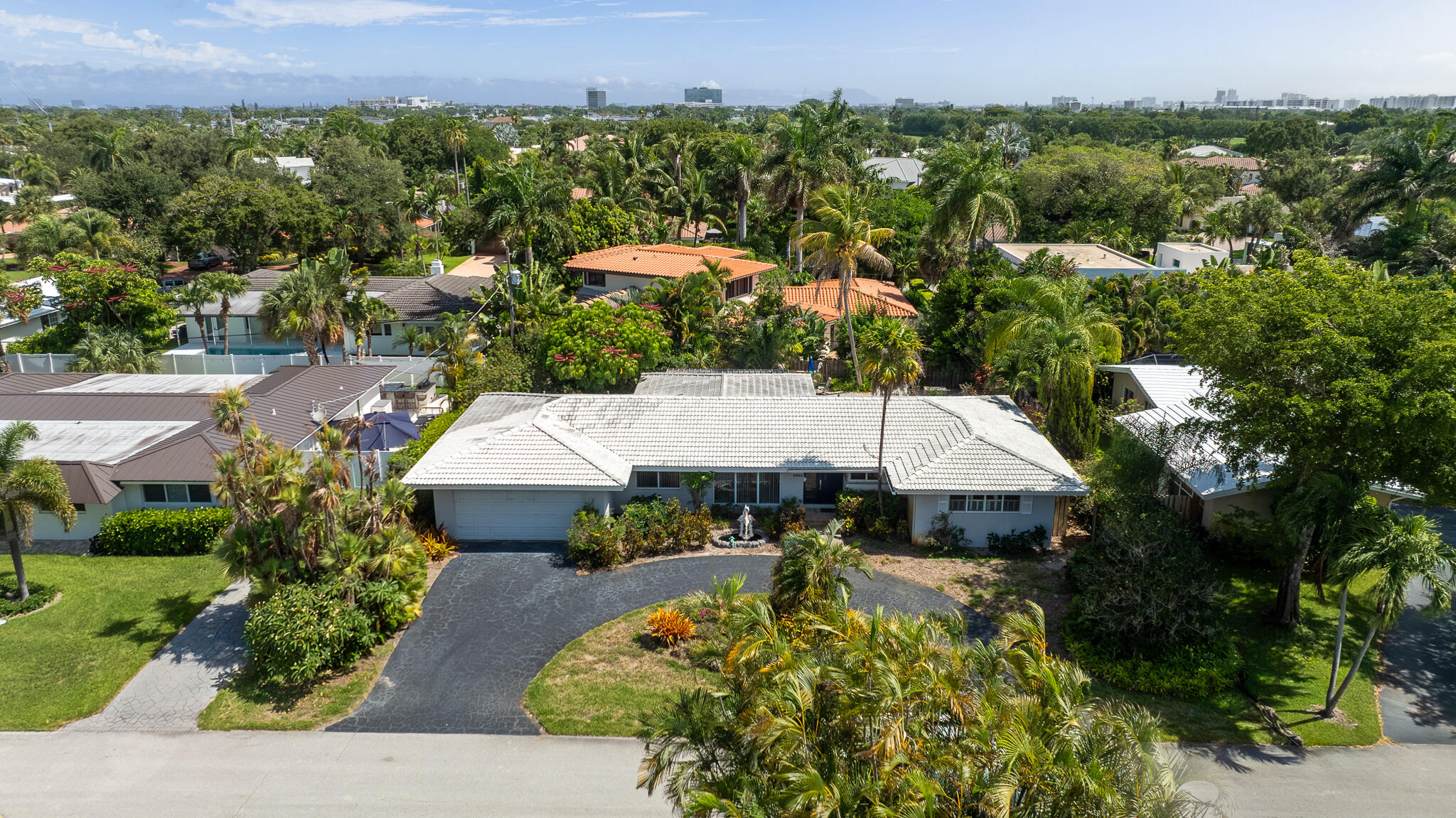 Great opportunity to get into The Coral Ridge Country Club community of Fort Lauderdale,  3/2 with pool, offering 2,207 square feet of finished living space. The home features a 2-car garage for convenient parking and vehicle storage. This thoughtfully designed residence provides comfortable accommodations with practical layouts ideal for everyday living. Situated within the established Coral Ridge Country Club community, this property presents an excellent opportunity for those seeking a well-proportioned home in Fort Lauderdale. AS-IS Listing
