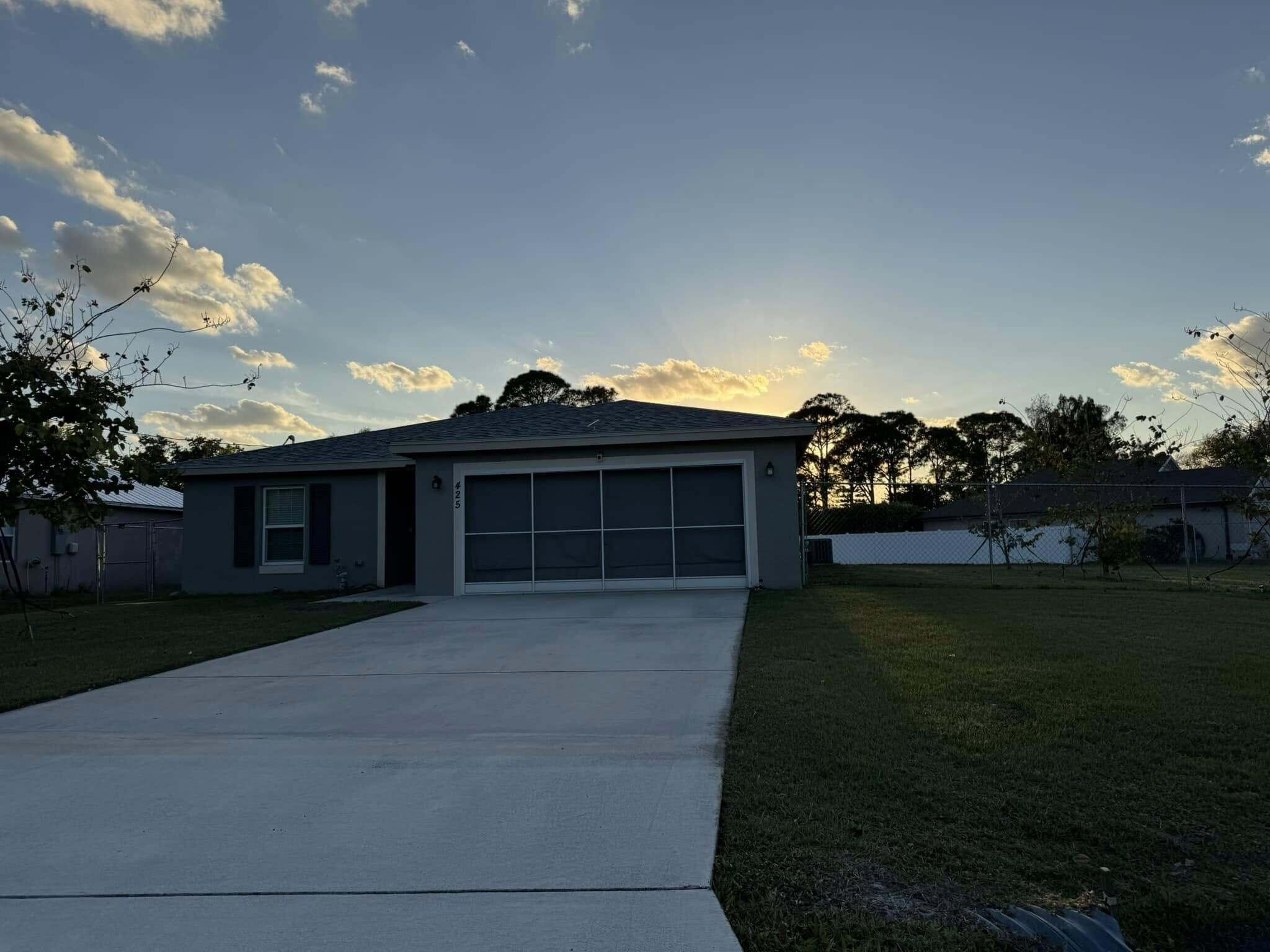 This home still looks and feels new!  This 4/2/2 CBS home, built by Synergy builders, features quality construction, multiple energy efficient features, spacious kitchen/dining/living room area, large island in the kitchen, quartz counter-tops, plenty of cabinet space, plenty of counter space, stainless steel appliances, a fenced-in large .40 acre lot big enough to build a large building to house your boat or RV, plenty of backyard space to build a pool and make your own tropical paradise!  Conveniently located near shopping and dining, and minutes from the beach.  Schedule your private showing today.