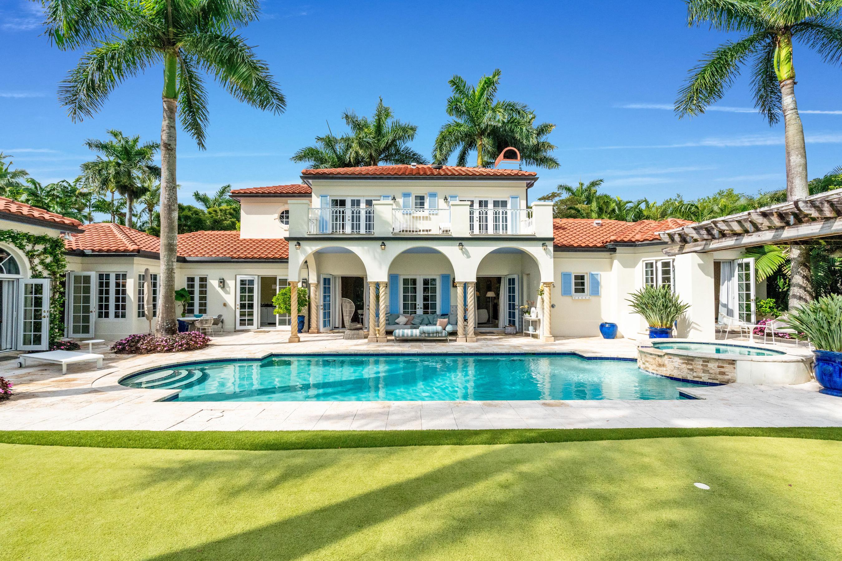 Luxury meets timeless elegance in this stunning 5-bedroom, 6.1-bath estate in the Palm Beach Polo Club, surrounded by lush tropical landscaping and serene preserve views. From the moment you enter through the private front courtyard, you'll be captivated by the European-inspired charm, marble and wood flooring, and abundant natural light streaming through custom shutters and French doors. The thoughtfully designed floor plan offers a 3-way bedroom split for ultimate privacy. The primary suite is conveniently located on the main floor, featuring direct access to a tranquil sitting area under a pergola by the pool. Upstairs, two bedrooms and two baths overlook the preserve from a private balcony, while an additional two-bedroom, two-bath guest suite sits above the 3-car garage, complete with private side-yard access and its own driveway, perfect for multi-generational living or guests. Enjoy elegant entertaining in the formal living and dining rooms, both opening to the covered patio and resort-style pool. The spacious family room off the chef's kitchen includes a wet bar, separate coffee station, and access to both the poolside patio and a second pergola-covered sitting area. Outdoors, the backyard is a private oasis featuring a sparkling pool, fountain, putting green, and multiple spaces for relaxation. Other highlights include a whole-house generator, impact windows and doors, 2015 roof, newer AC units, and a brick-paver driveway framed by mature Areca palms. Located in the heart of Wellington, this home offers the best the area has to offer, including world-class equestrian venues, premier schools, upscale shopping, and exceptional dining, all within minutes. A true private paradise that perfectly blends sophistication, comfort, and the Wellington lifestyle.