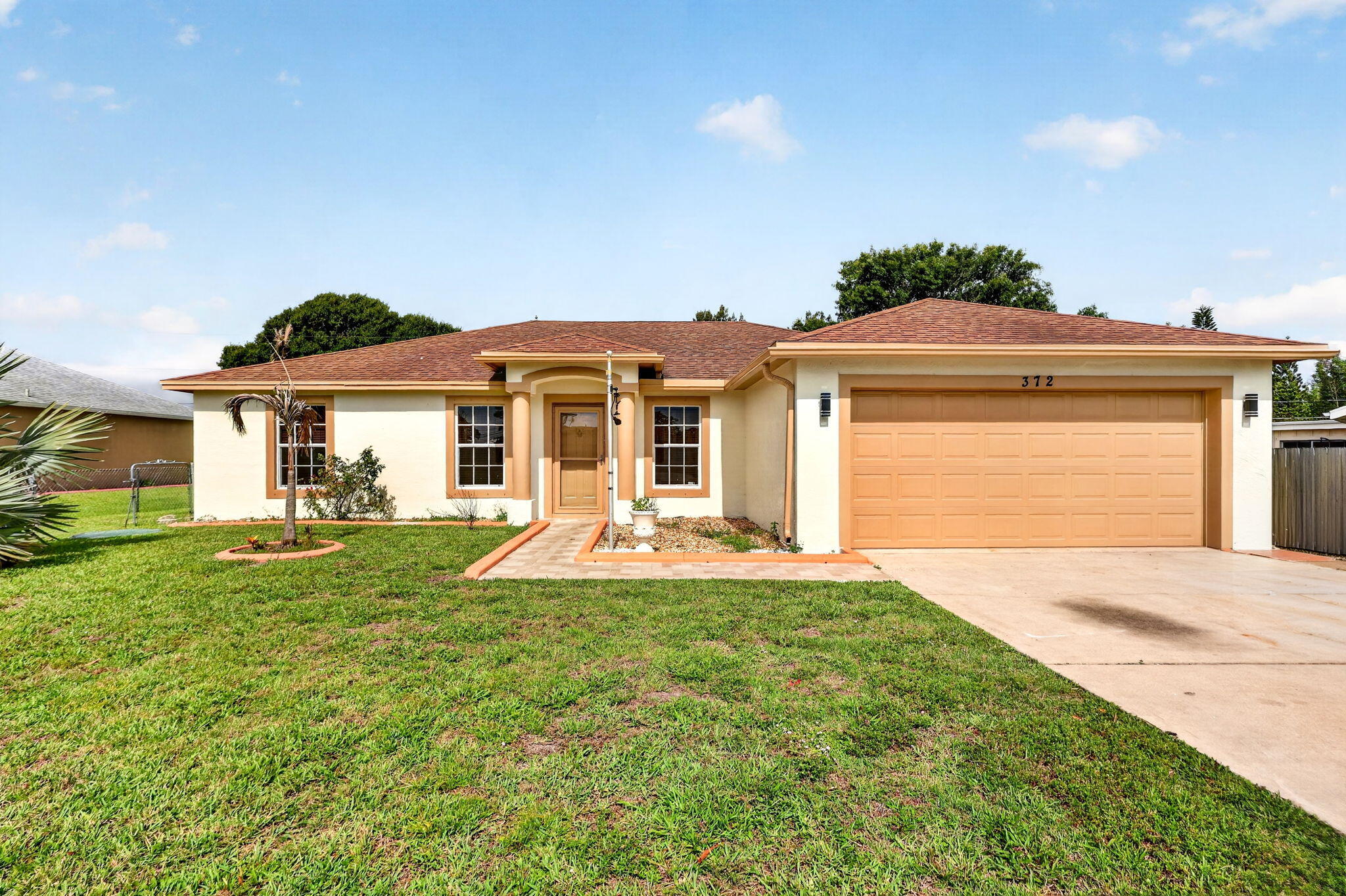 Beautifully maintained and move-in ready, this home offers a spacious layout with separate living, family, and formal dining areas. The updated kitchen and remodeled bathrooms feature modern finishes and thoughtful design. Enjoy outdoor living year-round from the covered screened patio overlooking a fully fenced, private backyard. Conveniently located near shopping, restaurants, and beaches, this home also includes an oversized garage with plenty of storage space, an automatic door opener, and pull-down attic access. A perfect blend of comfort, style, and location.