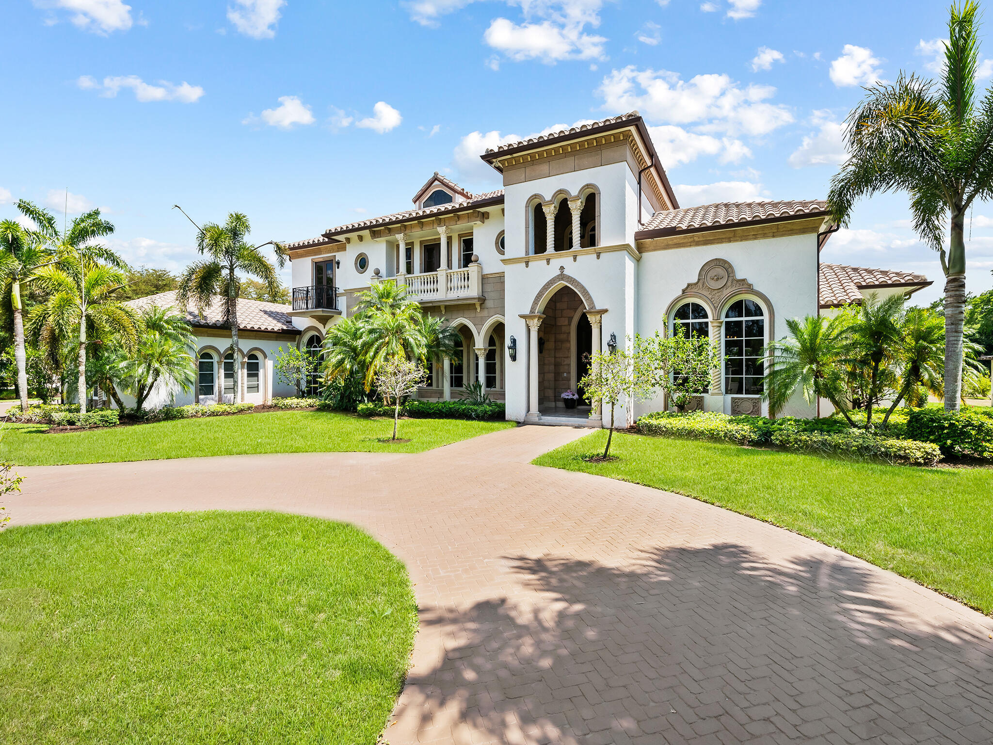 Located on one of the premier streets in Parkland's highly sought-after BBB Ranches, this palatial gated estate sits on 3 private, fenced acres with city water, a 6-foot perimeter fence, and an electric gate. Offering more than 10,000 square feet of total living space, the elegant two-story residence showcases exceptional craftsmanship, refined architectural details, and meticulous maintenance throughout. The custom home features six bedroom suites, a library, an expansive game room, a loft area, custom-painted ceilings, two bar areas, built-ins throughout, two laundry rooms, a butler's pantry, stone flooring in the formal areas, and imported Afrormosia wood floors in the bedrooms and library. The state-of-the-art kitchen includes premium appliances, a center island, two dishwashers,  and a large walk-in pantry. Additional highlights include three gas fireplaces, a four-car garage, impact windows and doors, a full-house generator with a 1,000-gallon buried tank, Lutron lighting, a Crestron sound system, and crown molding throughout. The property also offers ample space for a custom pool, patio, horses, and stables.