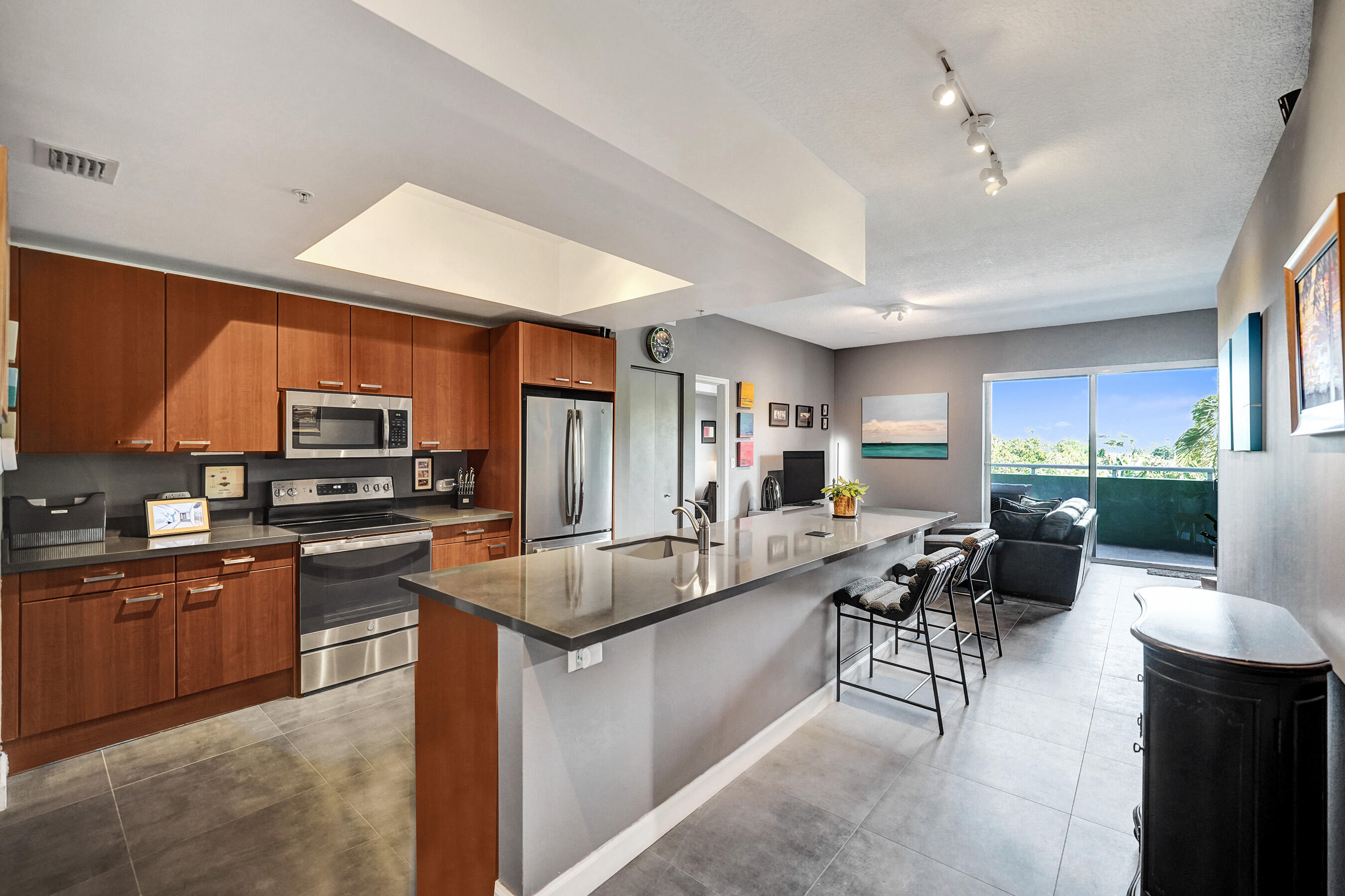 Imagine living at Island City Lofts, the only luxury high-rise building on Wilton Drive. Right outside your door is the heart of Wilton Manors-just seconds from top restaurants, vibrant nightlife, boutique shopping, & more. This beautifully renovated loft features stunning countertops, travertine floors, & soaring high ceilings that create an open, modern feel. The spacious primary suite offers a large ensuite bathroom, while the interior 2nd bedroom is complemented by an additional full bath. The owner sound proofed all the walls for additional comfort. Enjoy serene pool views from your private balcony. Building amenities include a heated & chilled resort-style pool, fitness center, secured lobby, storage unit, & 2 parking spaces. Furniture Optional. 1 Year Lease.