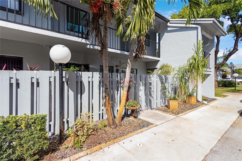 A condo that feels like you're in a home. This lovely, highly upgraded condo in Delray Beach is just that. An end unit on the 1st floor offers extra windows for abundant light. Courtyard entry give you private outdoor space.  Inside you have a Euro-Style Kitchen w/New Appliances, Under Cabinet Lighting and built in dining. This unit was stripped to the studs and rebuilt with new electrical and plumbing (all permitted) There is a new A/C, Water Heater and Washer and Dryer. Enclosing the rear patio created an Primary Suite with room for an office or sitting room. The primary bath has an space aged shower and euro fixtures.  All windows (except sliders) are impact rated. Located on a greenbelt near the pool. Community is quiet and suburban, yet it's just minutes to major stores and dining.